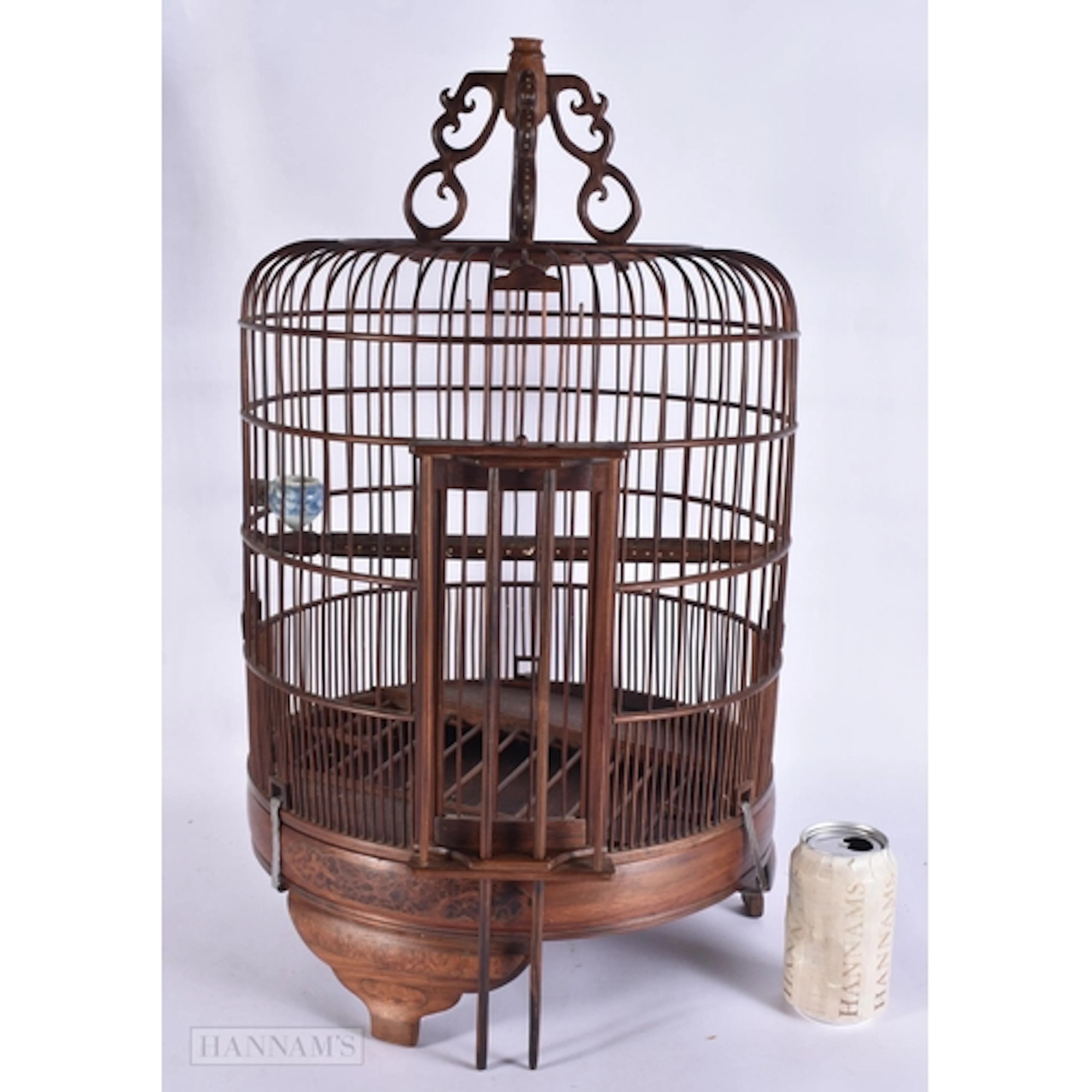 A LARGE CHINESE HUANGHUALI AND BURR WOOD BIRD CAGE with blue...