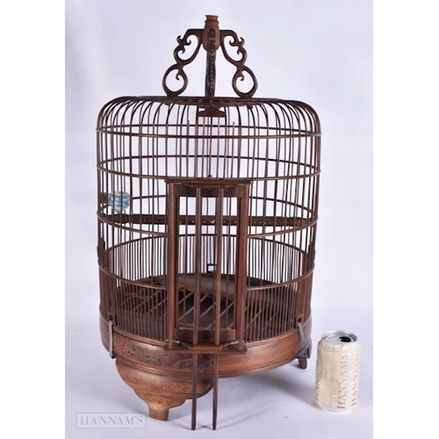 A LARGE CHINESE HUANGHUALI AND BURR WOOD BIRD CAGE with blue...
