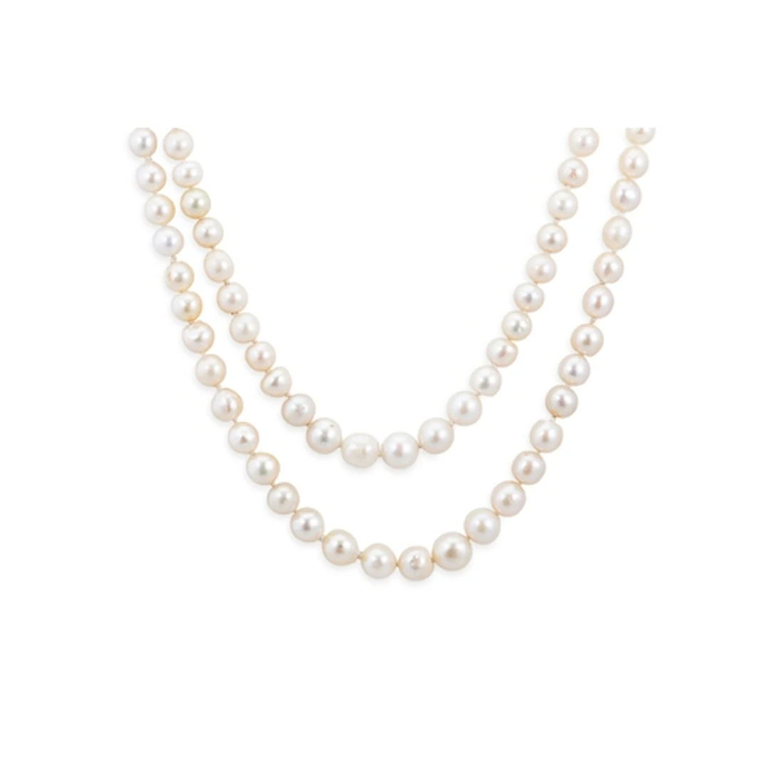 A TWO ROWED STRING OF CULTURED PEARLS, with a 9ct gold clasp...