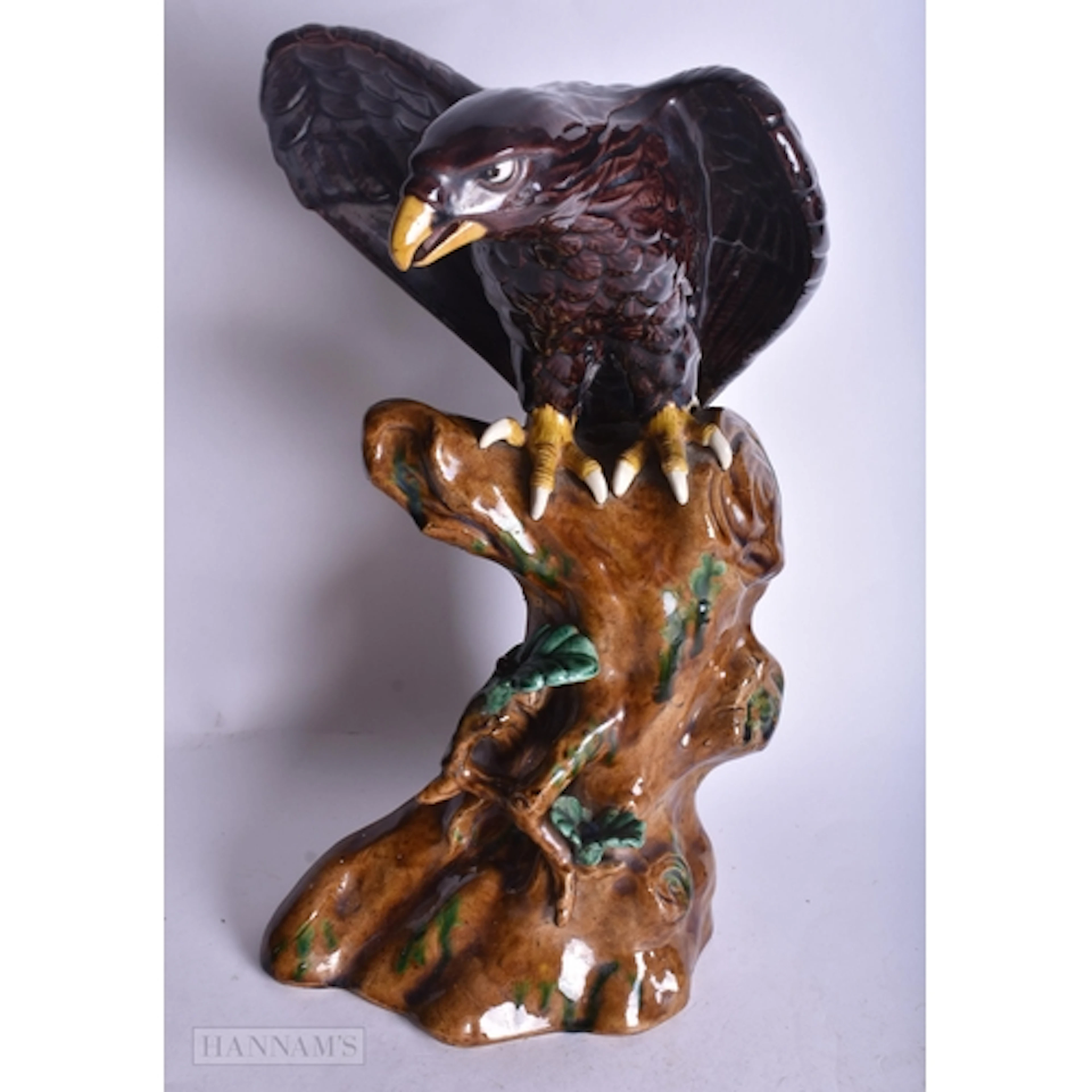 A MID 20TH CENTURY RUSSIAN PORCELAIN FIGURE OF A EAGLE PERCH...
