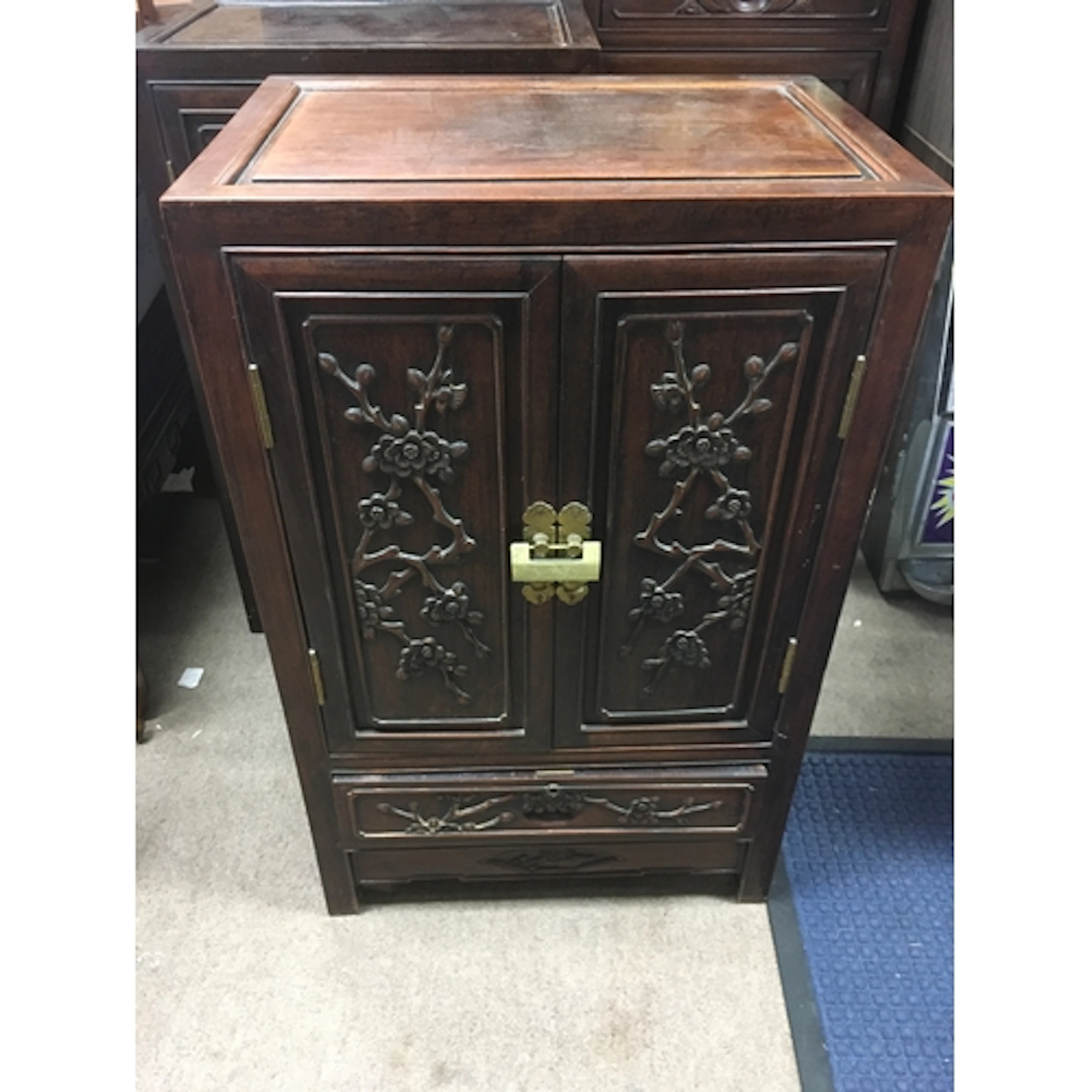 Three vintage Chinese hardwood cabinets featuring carved flo...