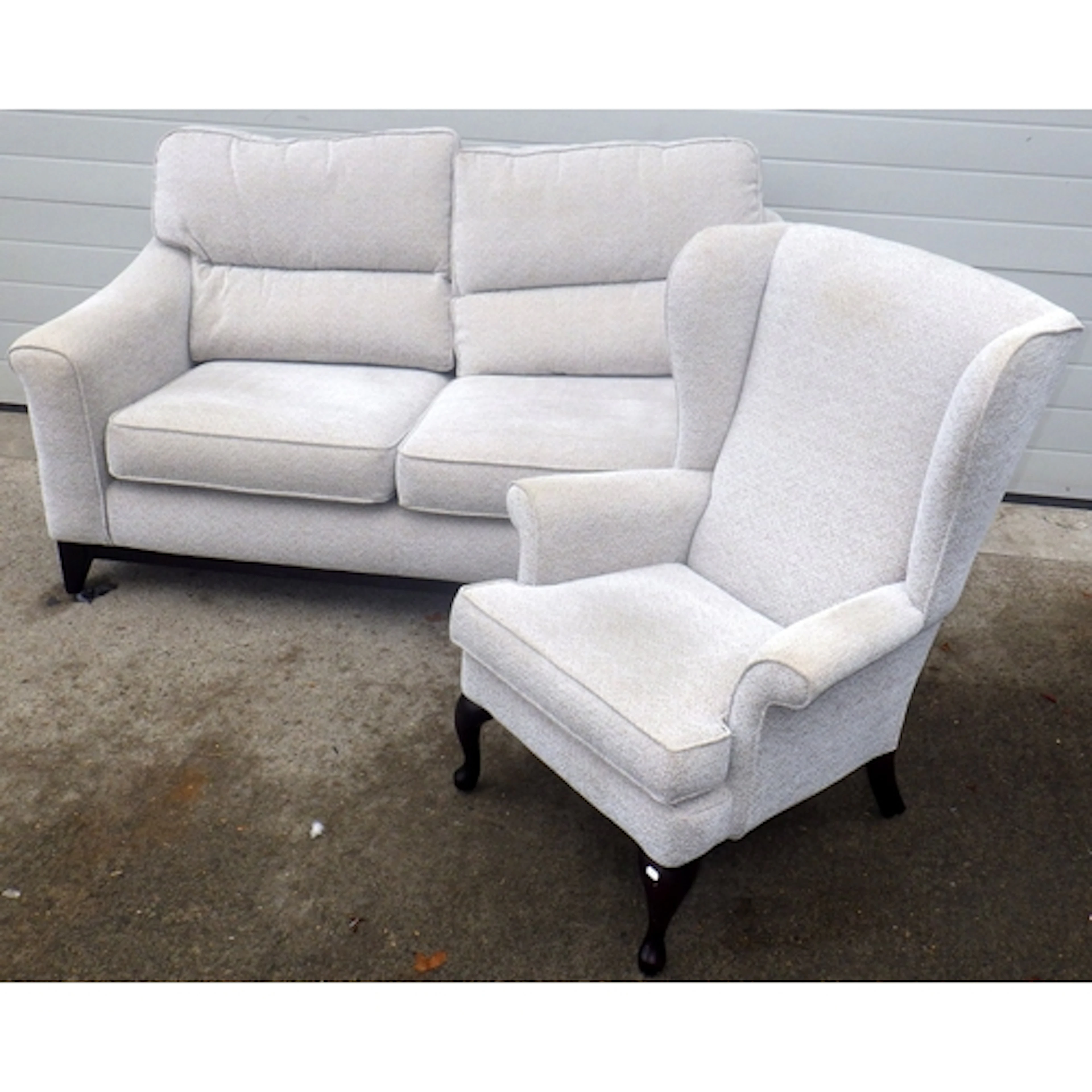 A Parker Knoll settee and a wingback chair, marks (2)