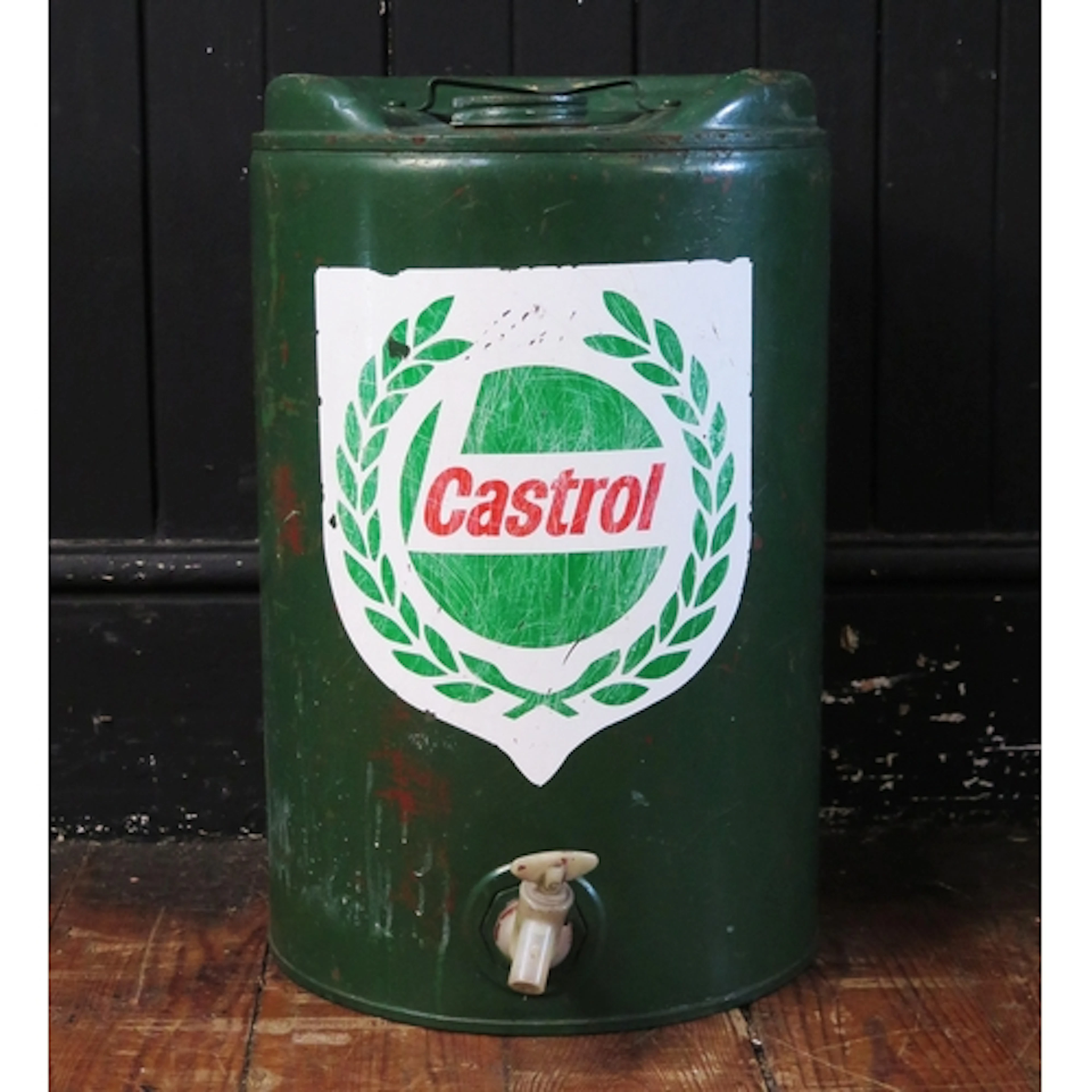 A Castrol green painted tin oil can, of cylindrical form, wi...