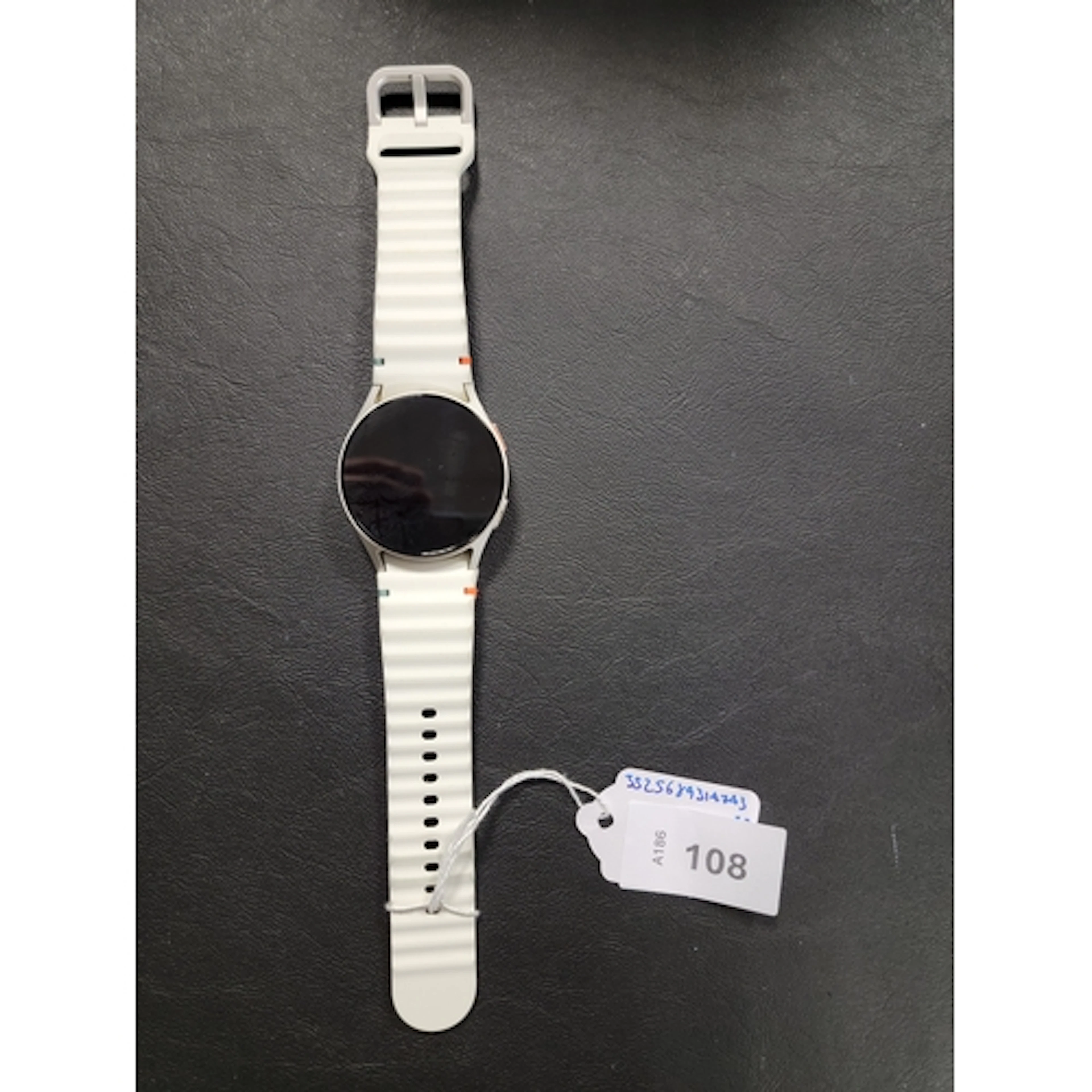 SAMSUNG GALAXY WATCH 7 model SM-L305F, serial number RFAX73X...