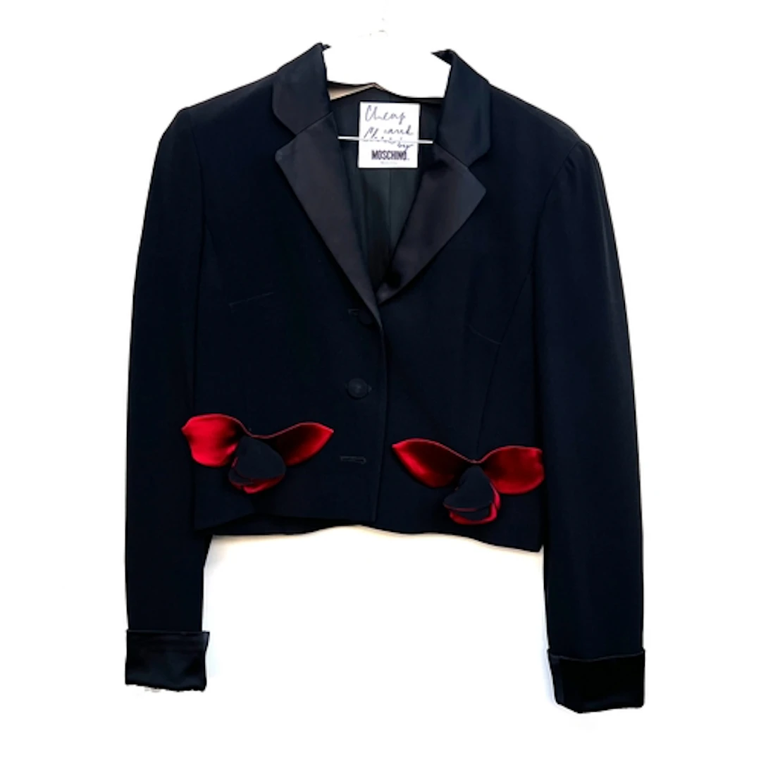 A Moschino 'Cheap and Chic' short black jacket with applied ...