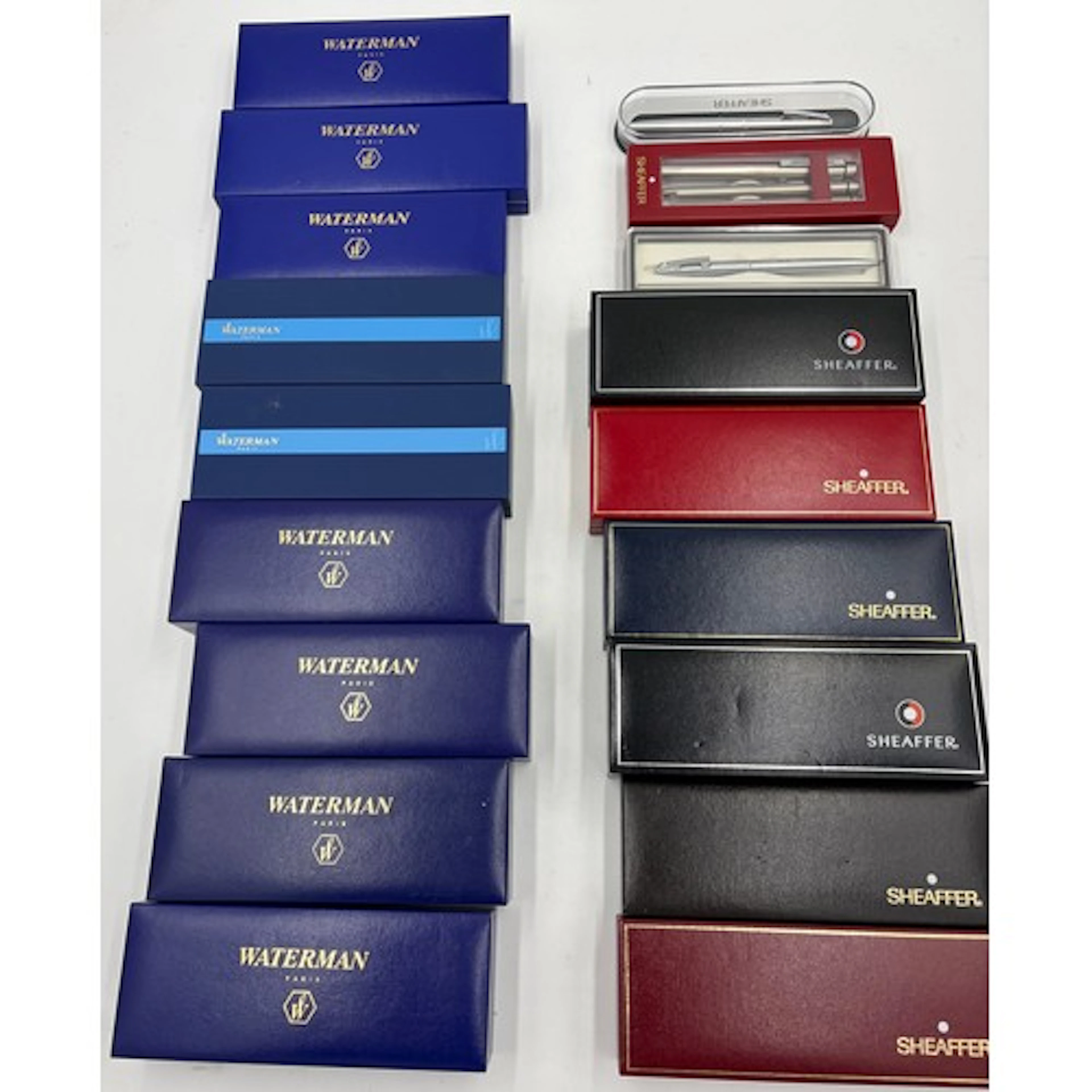 A collection of boxed Waterman and Sheaffer pens. Waterman t...