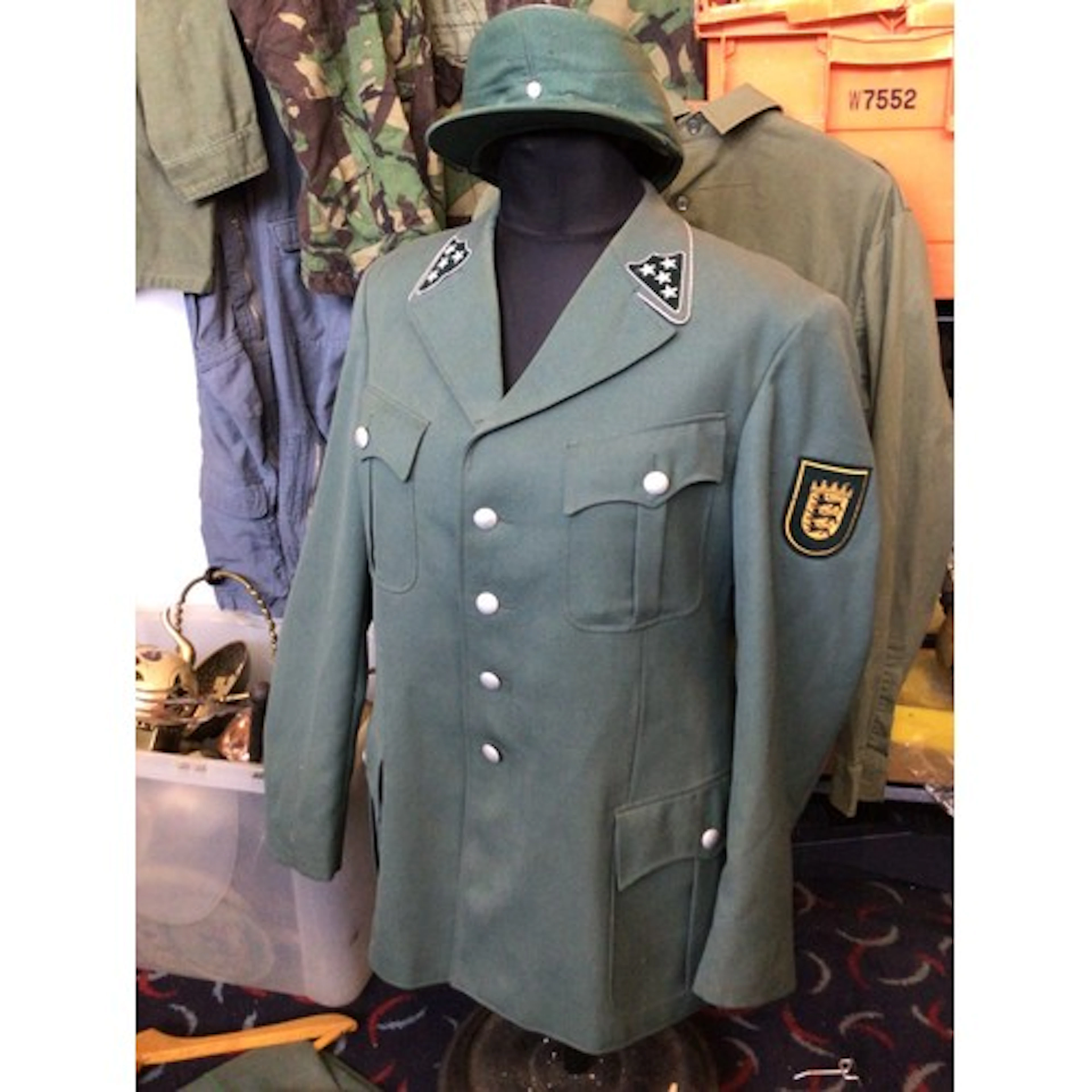 A German 1950s Police Uniform with hat and trousers.