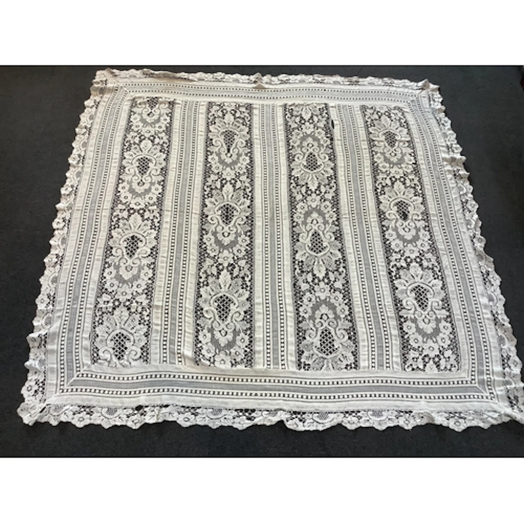 An early 20th century continental cream hand bobbin lace and...