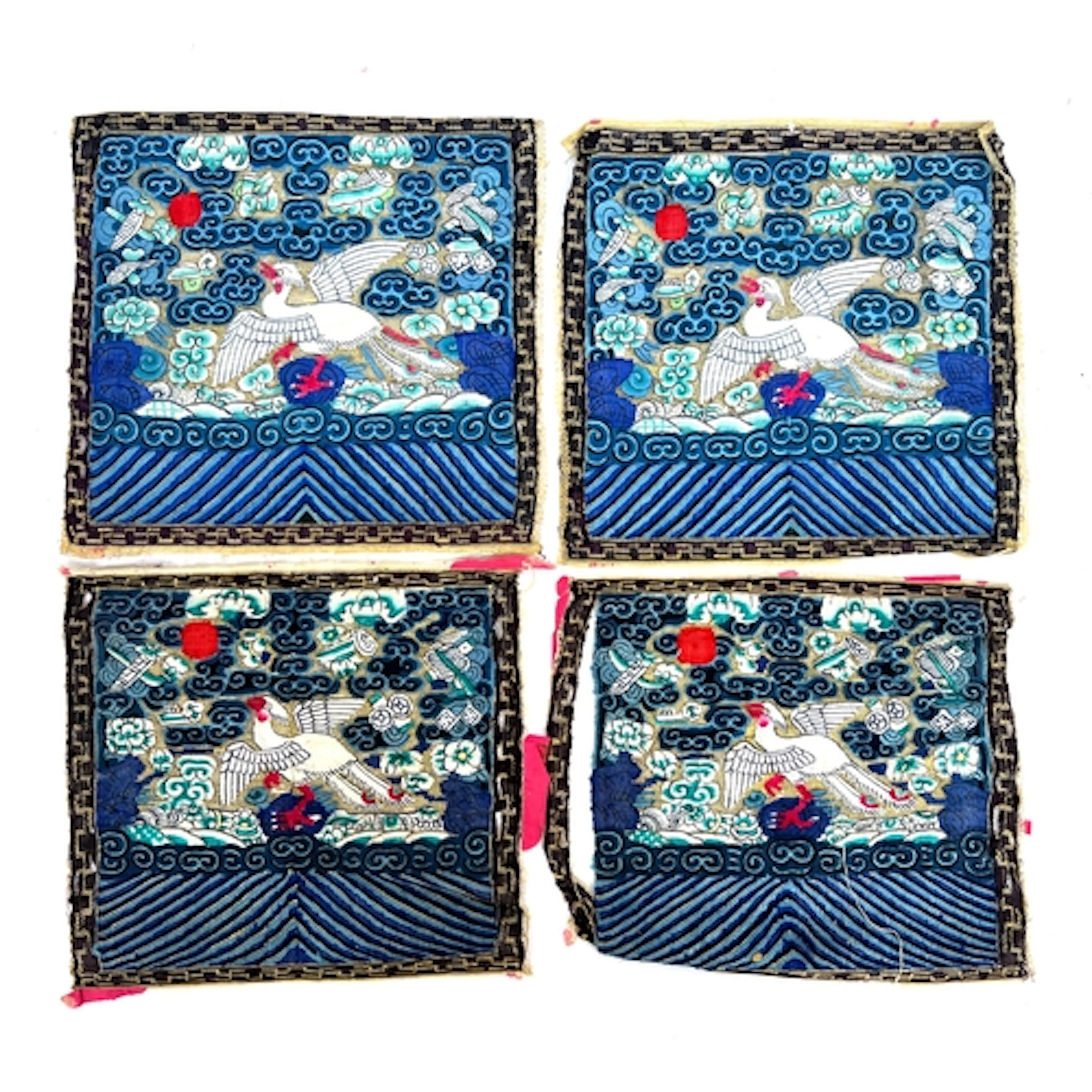 Four early 20th century Chinese rank badges depicting a silv...