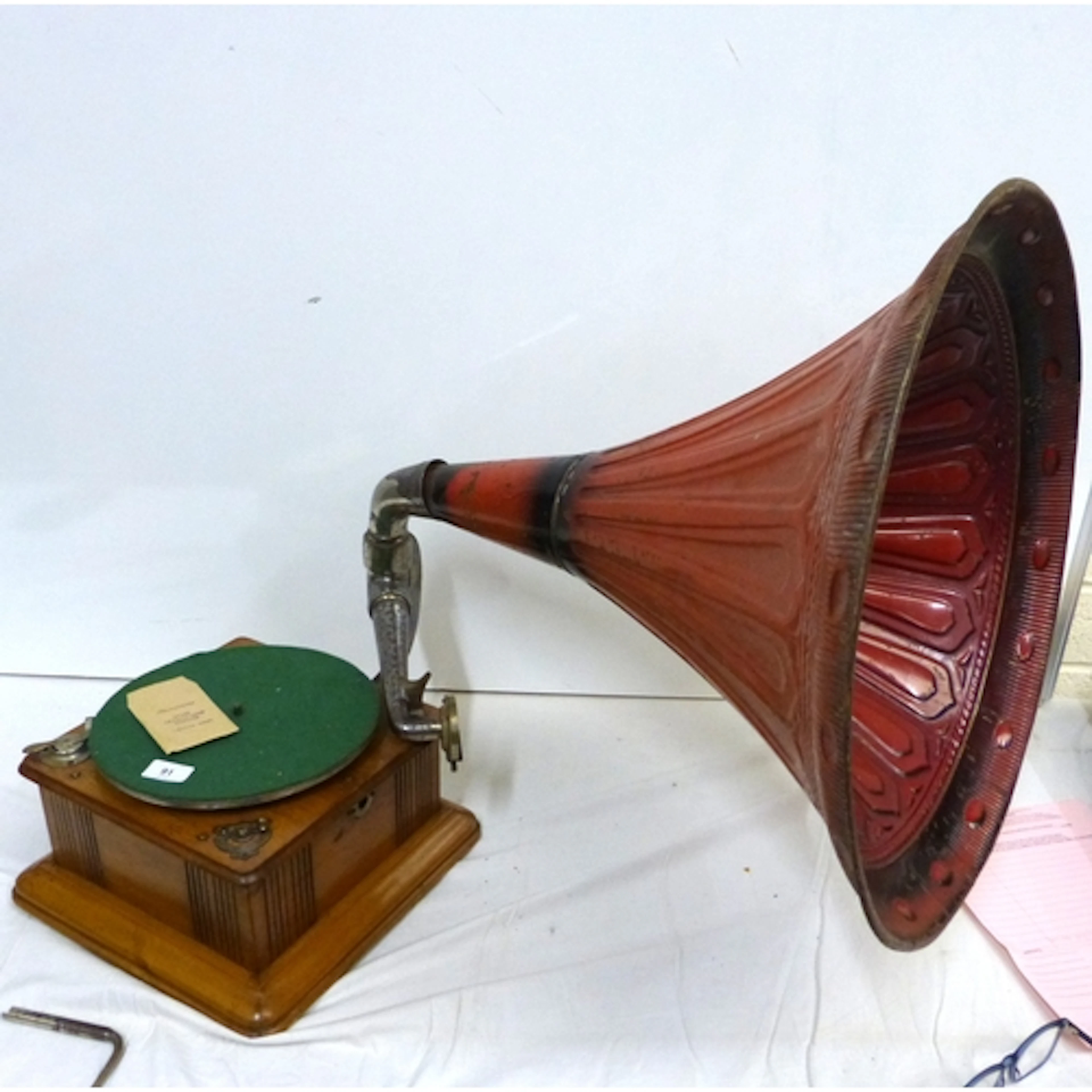 Antique gramophone with handle with spare needles.