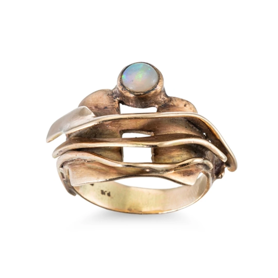 AN ABSTRACT OPAL RING, the bezel set opal to a wavy abstract...