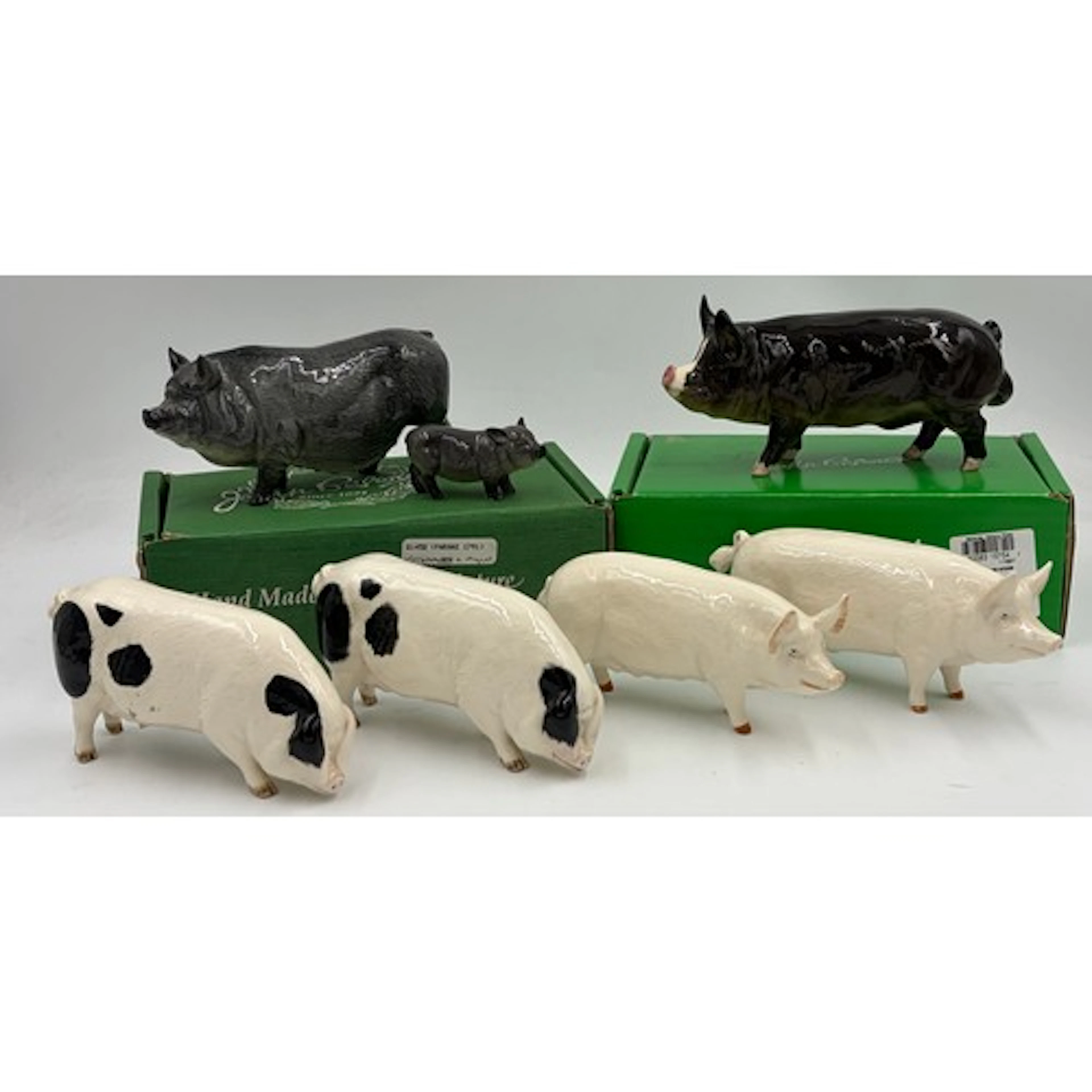 Beswick: A collection of pigs to include Vietnamese pot bell...
