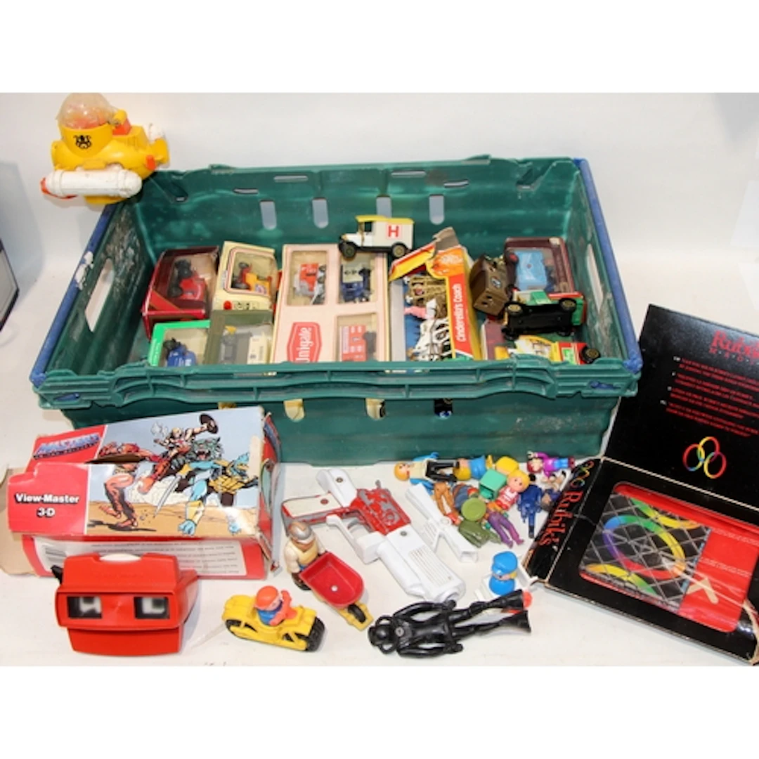 A collection of vintage toys including die-cast vehicles