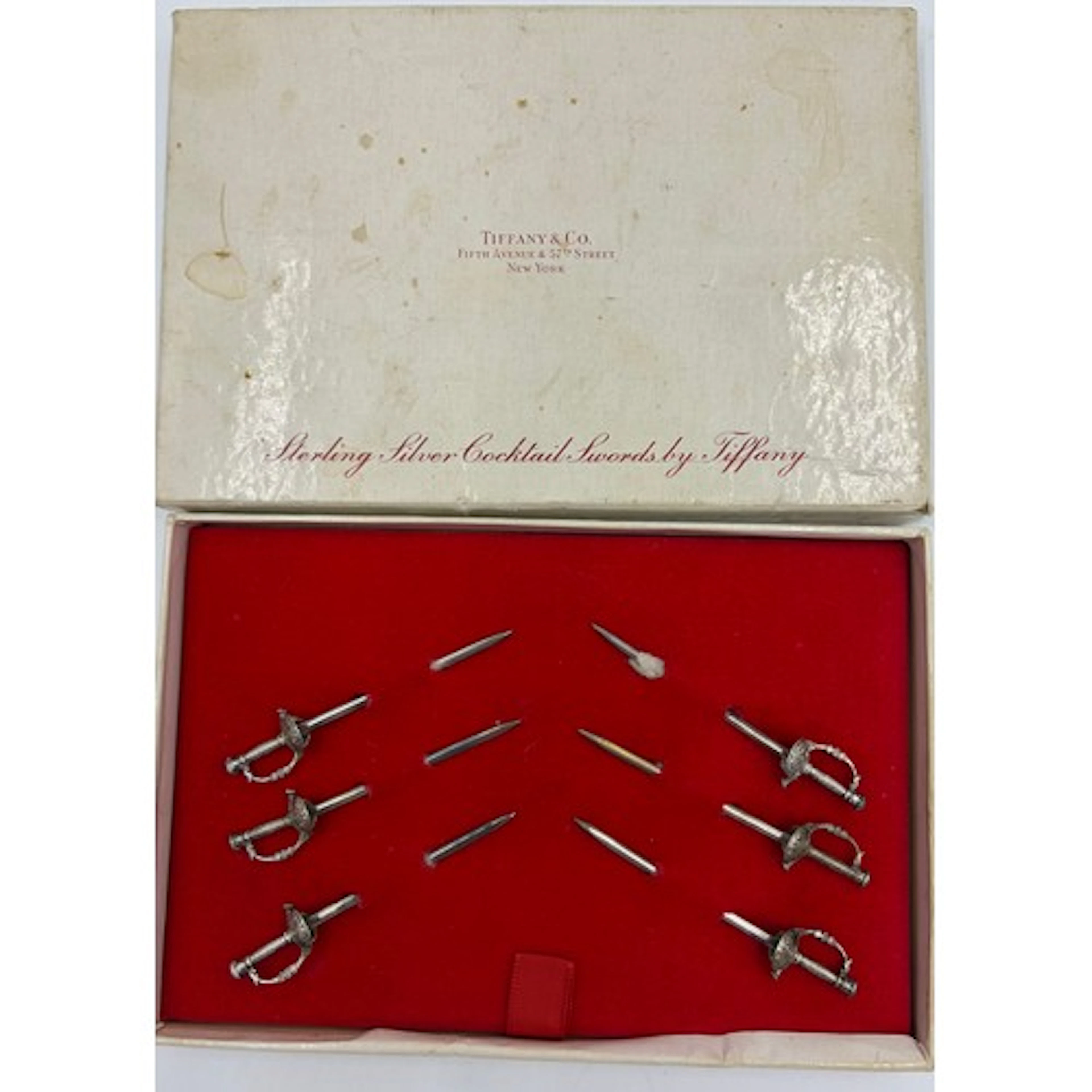 A set of six Tiffany & Co sterling silver cocktail swords in...