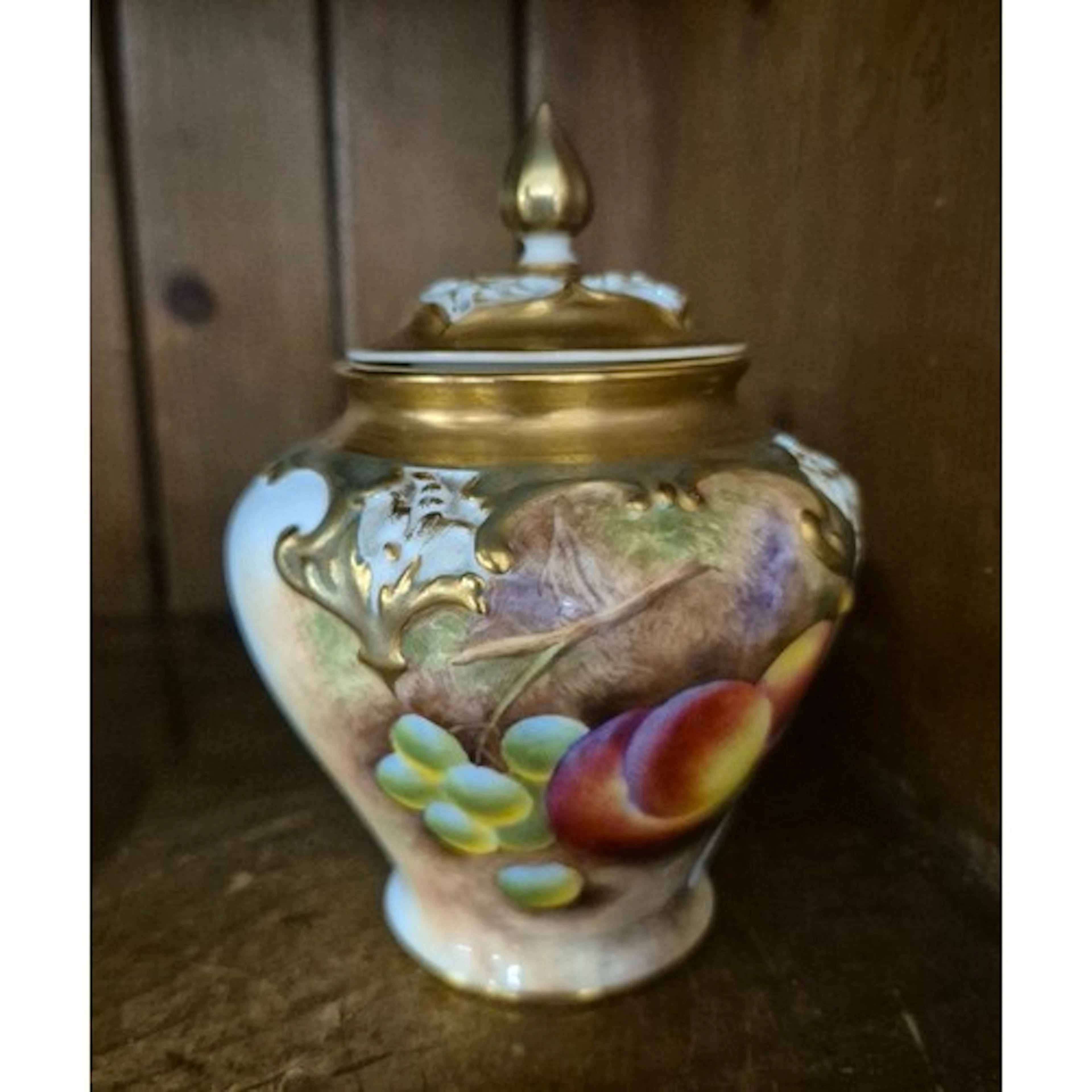 A Royal Worcester pot pourri lidded jar with peach and grape...