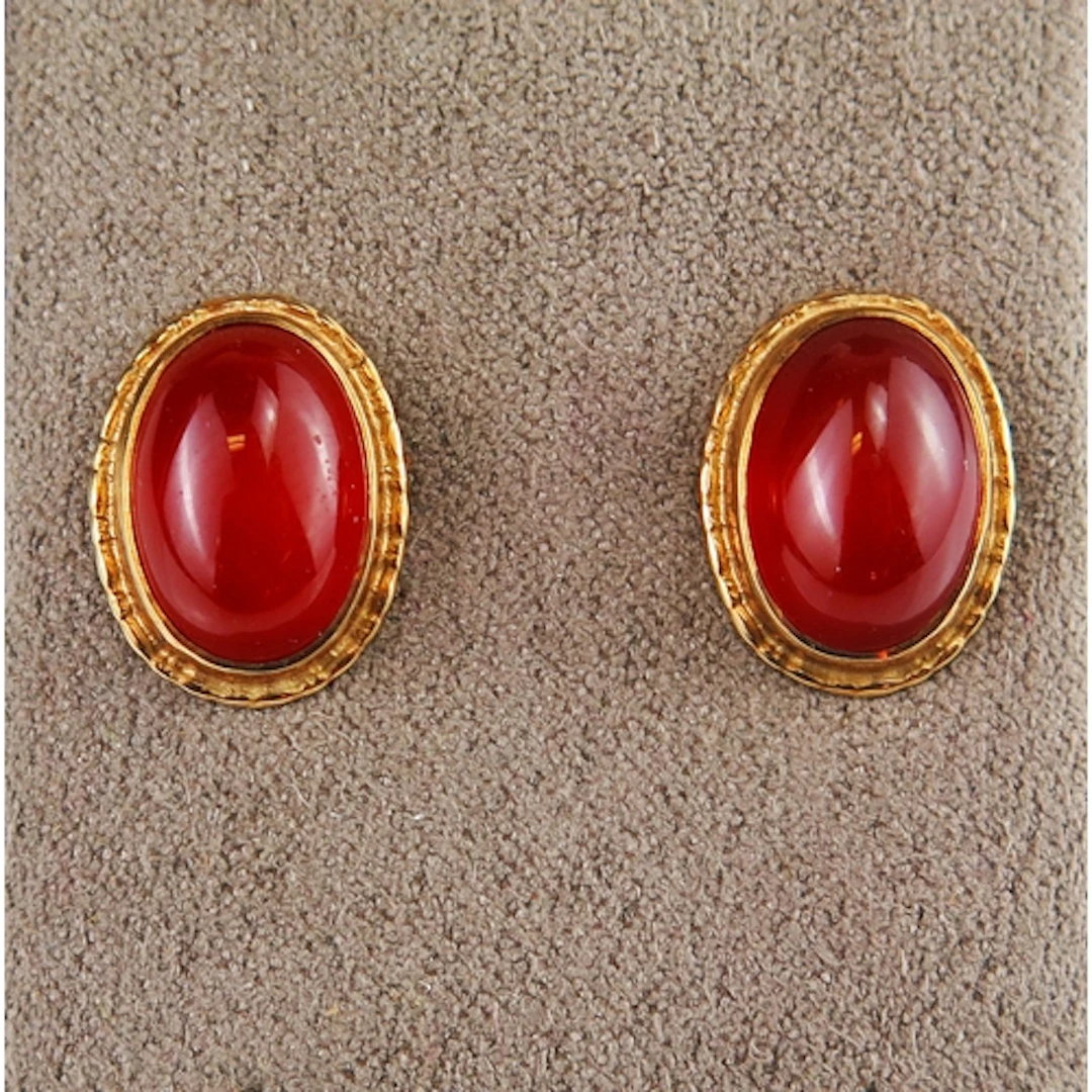 A pair of carnelian stud earrings in 9ct yellow gold setting...