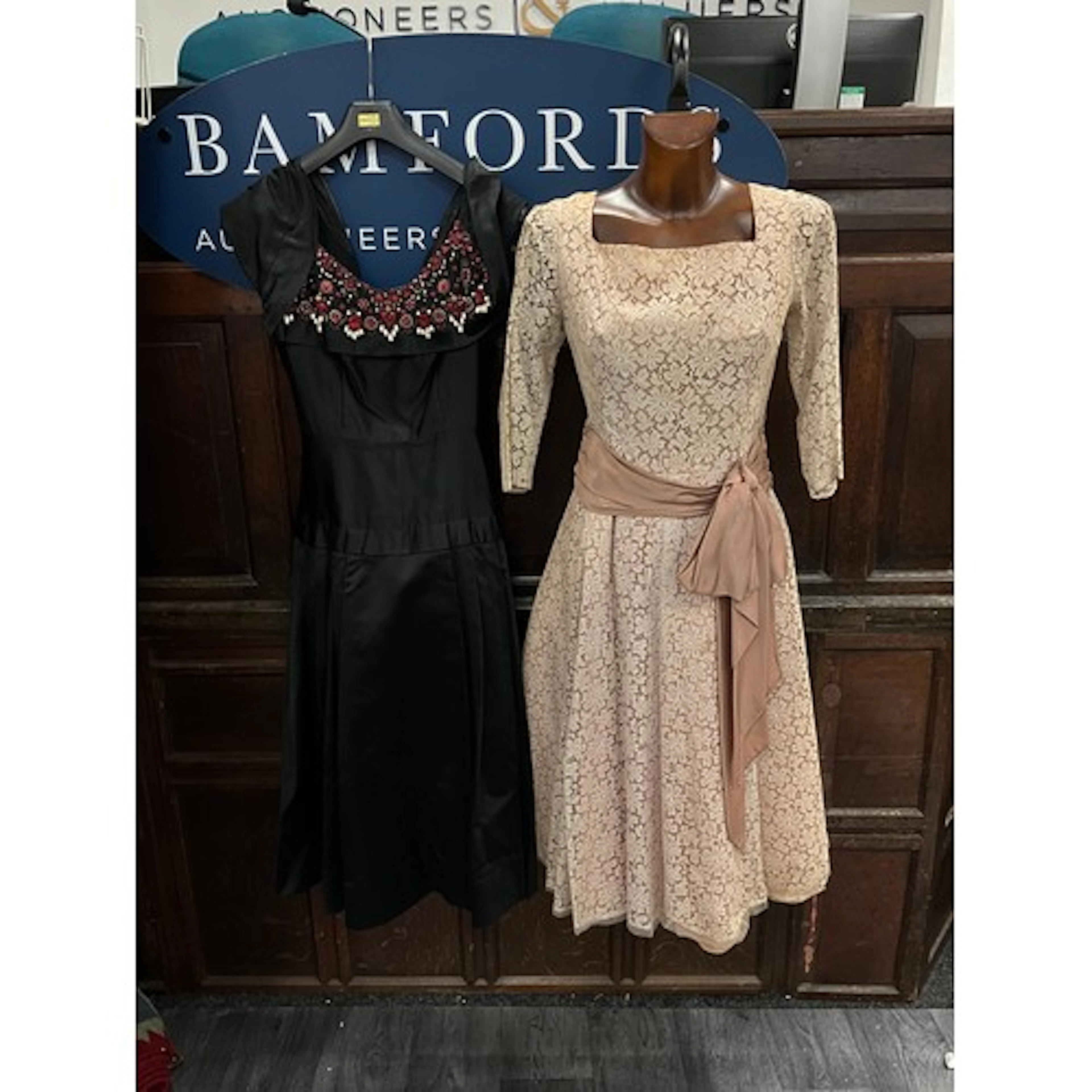 A 1950s Norman Hartnell black velvet dress, fitted bodice, e...