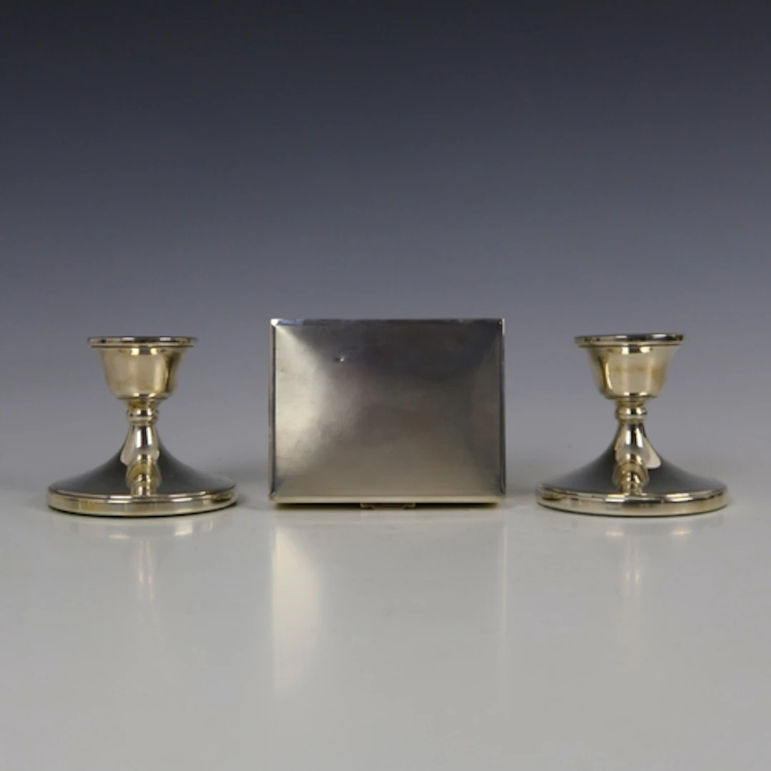 A pair of late 20th century silver mounted dwarf candlestick...