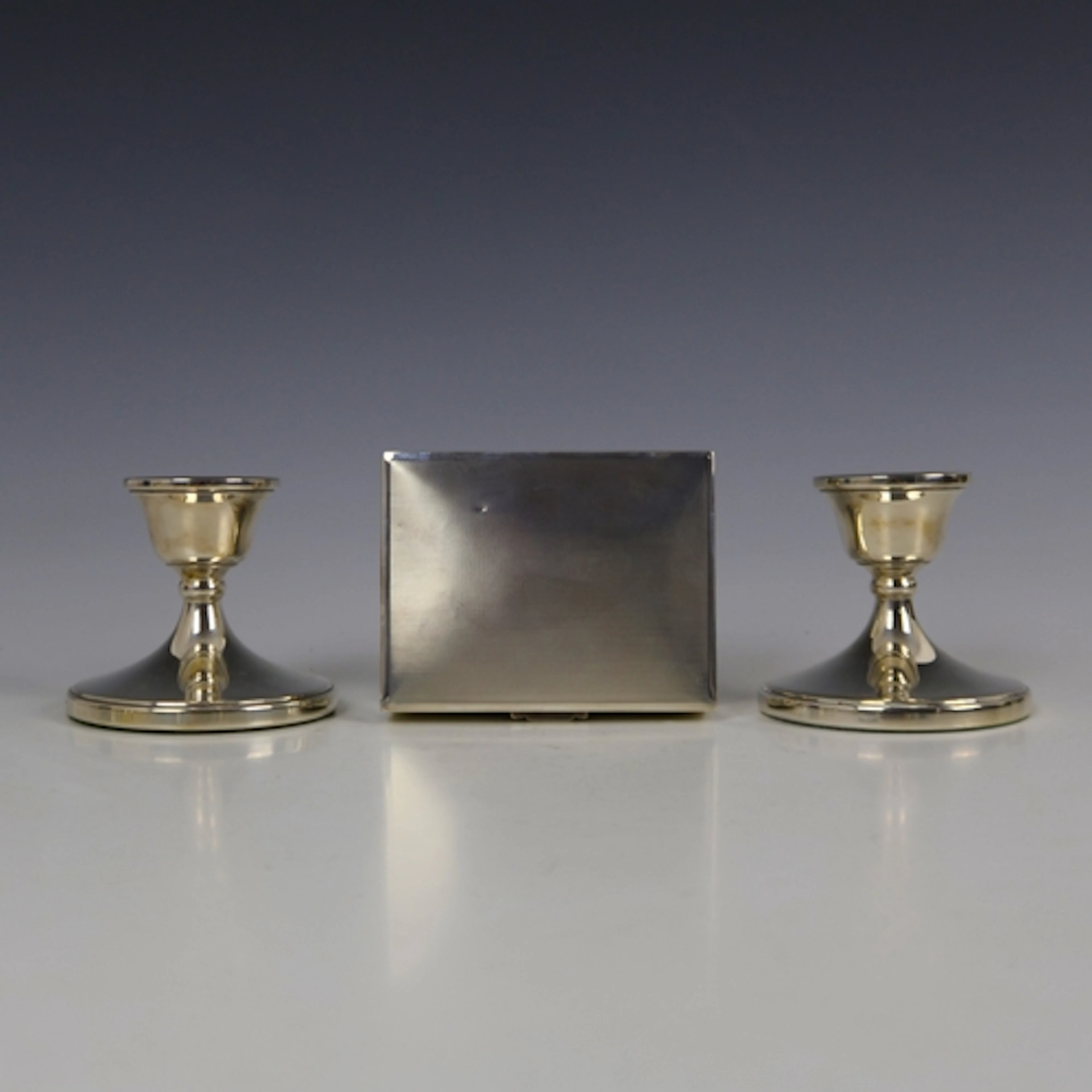 A pair of late 20th century silver mounted dwarf candlestick...