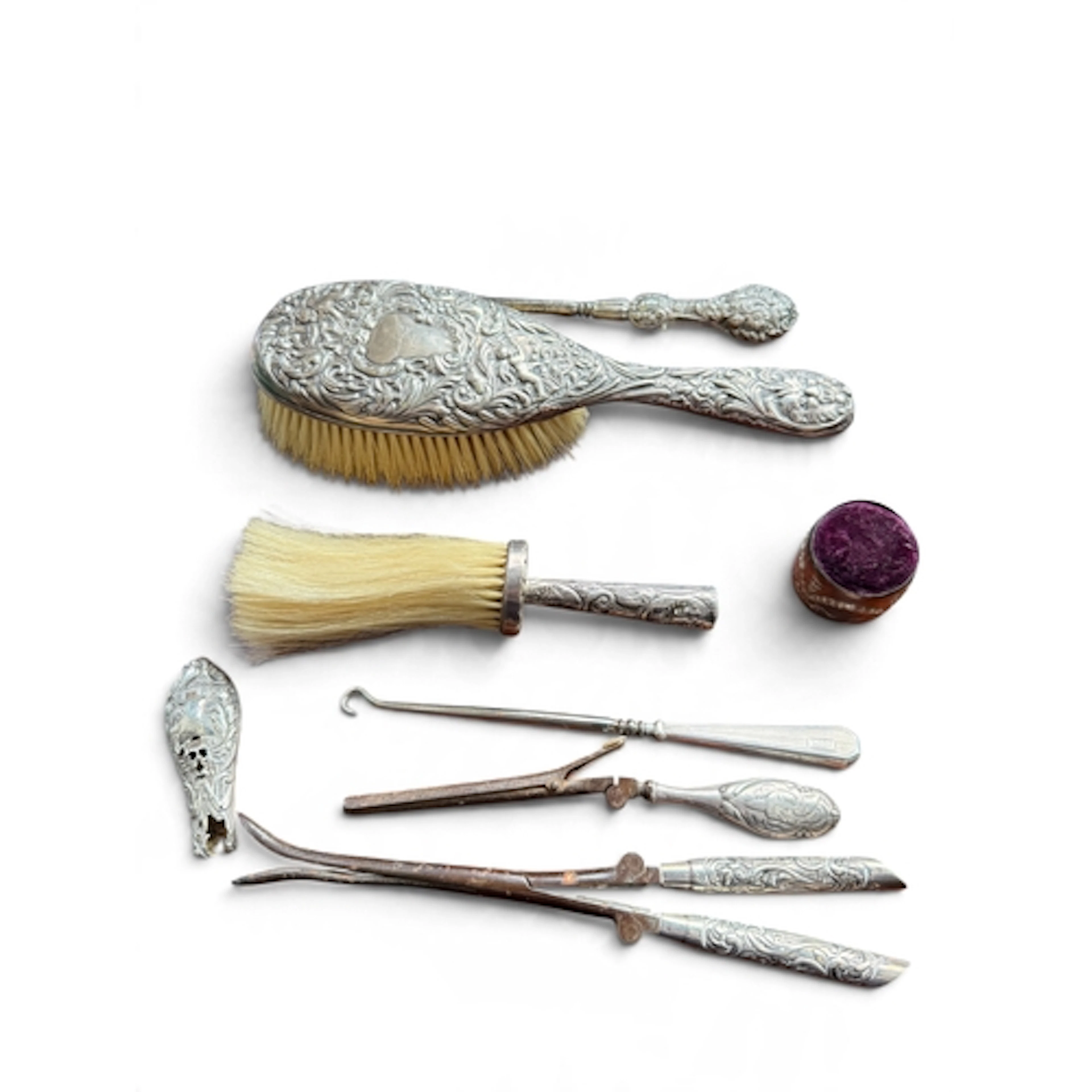 A GROUP OF SILVER VANITY ITEMS TO INCLUDE BRUSHES, PIN CUSHI...