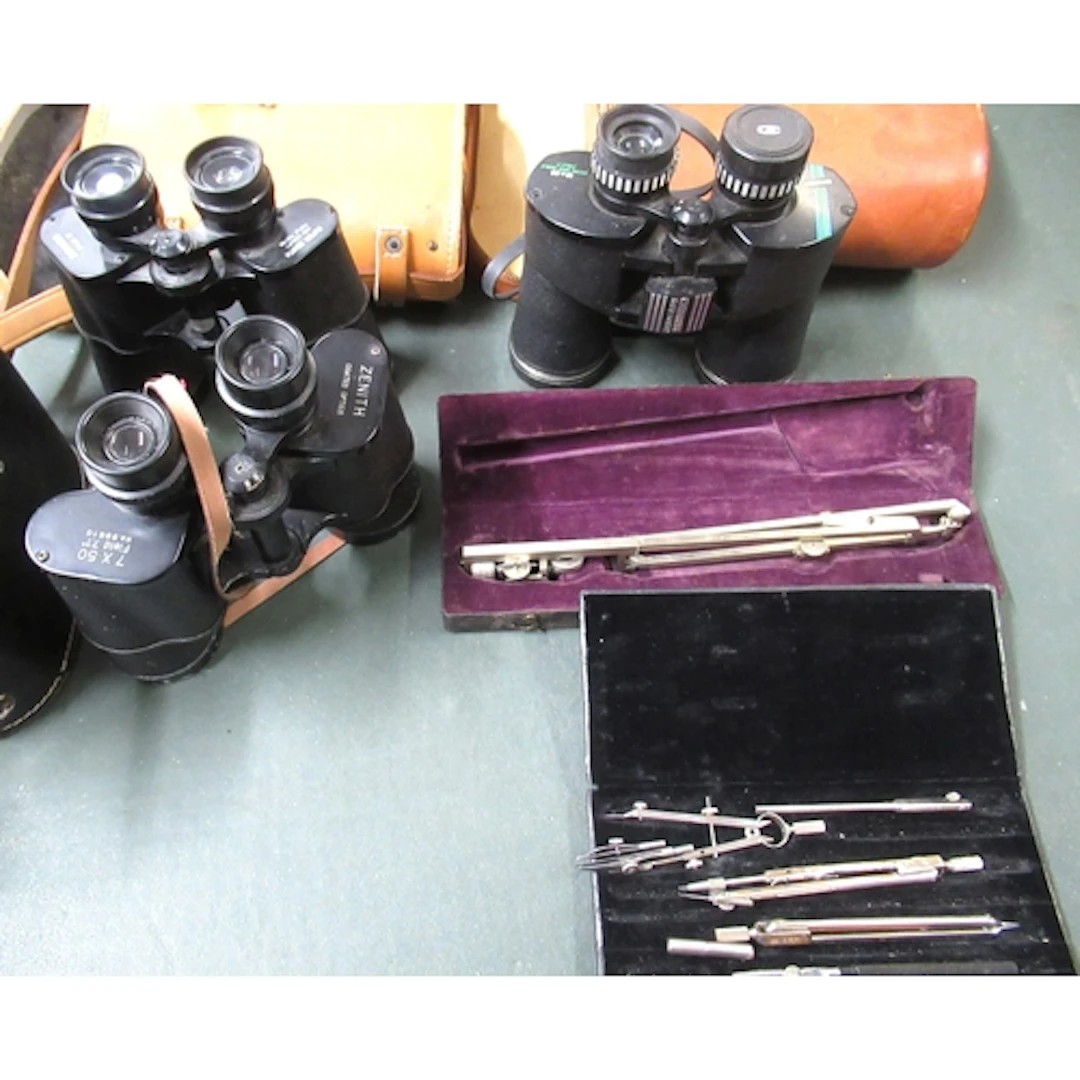 Three cased pairs of binoculars, together with a quantity of...