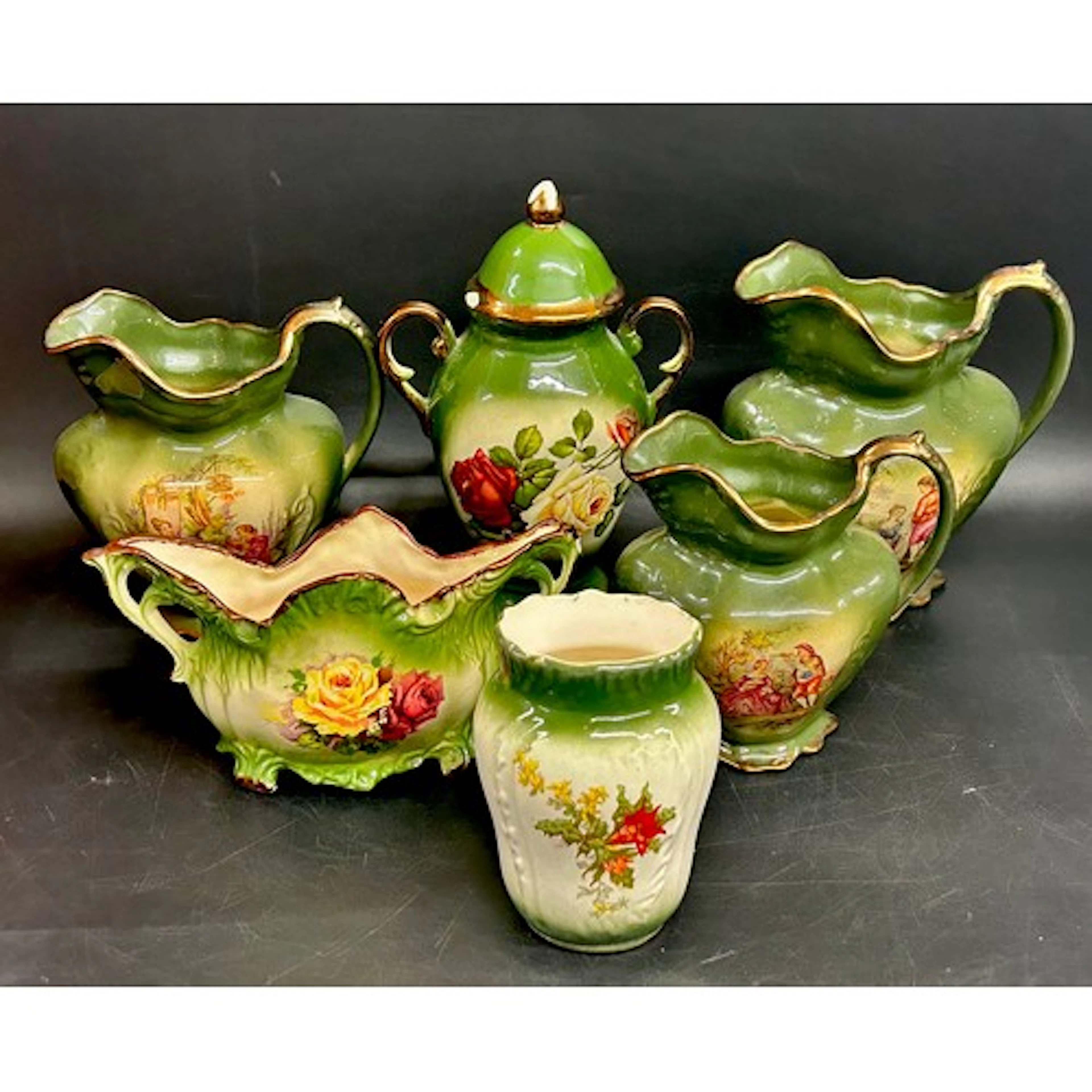 A collection of Staffordshire green pottery to include plant...