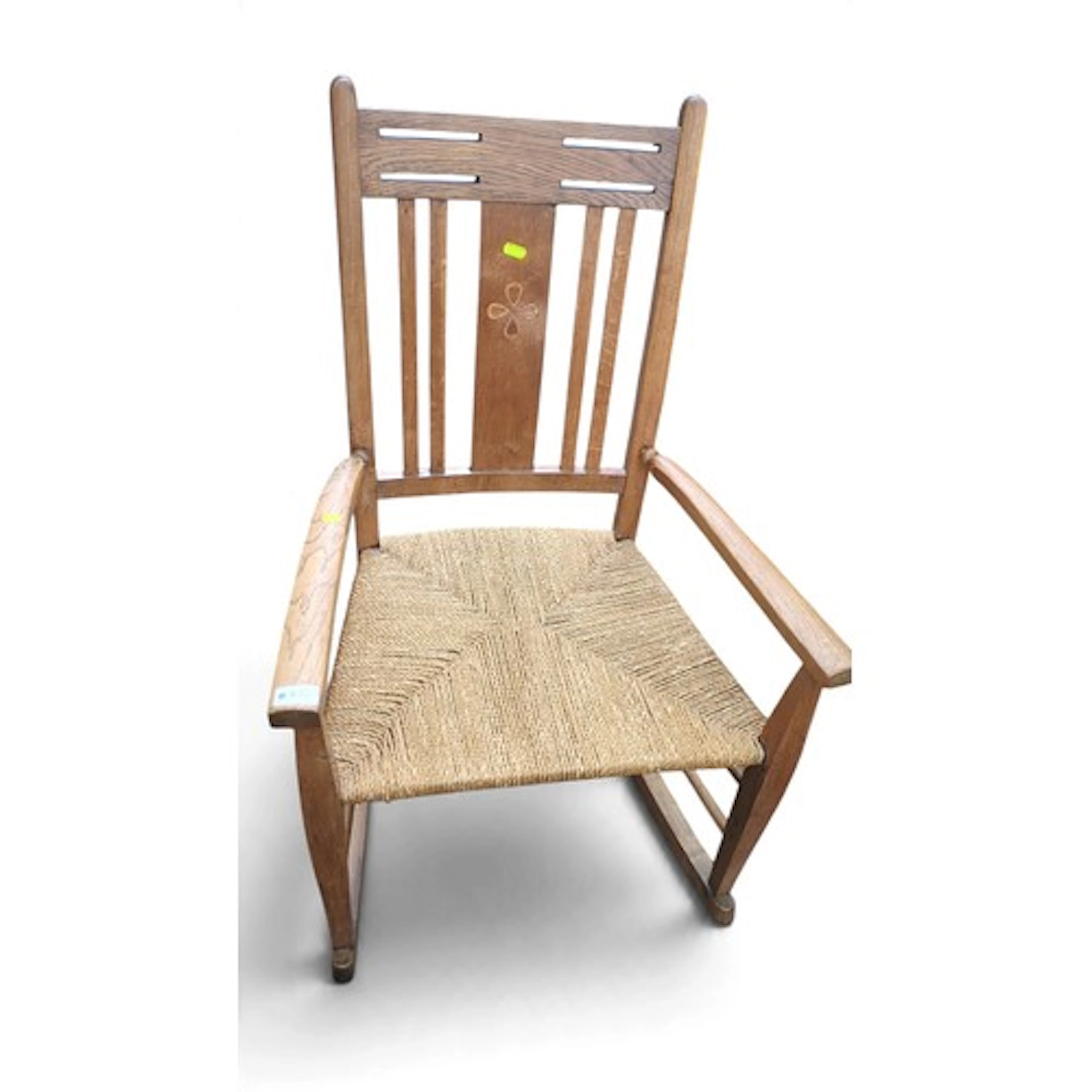 Arts and Crafts oak rocking armchair, the slatted back with ...