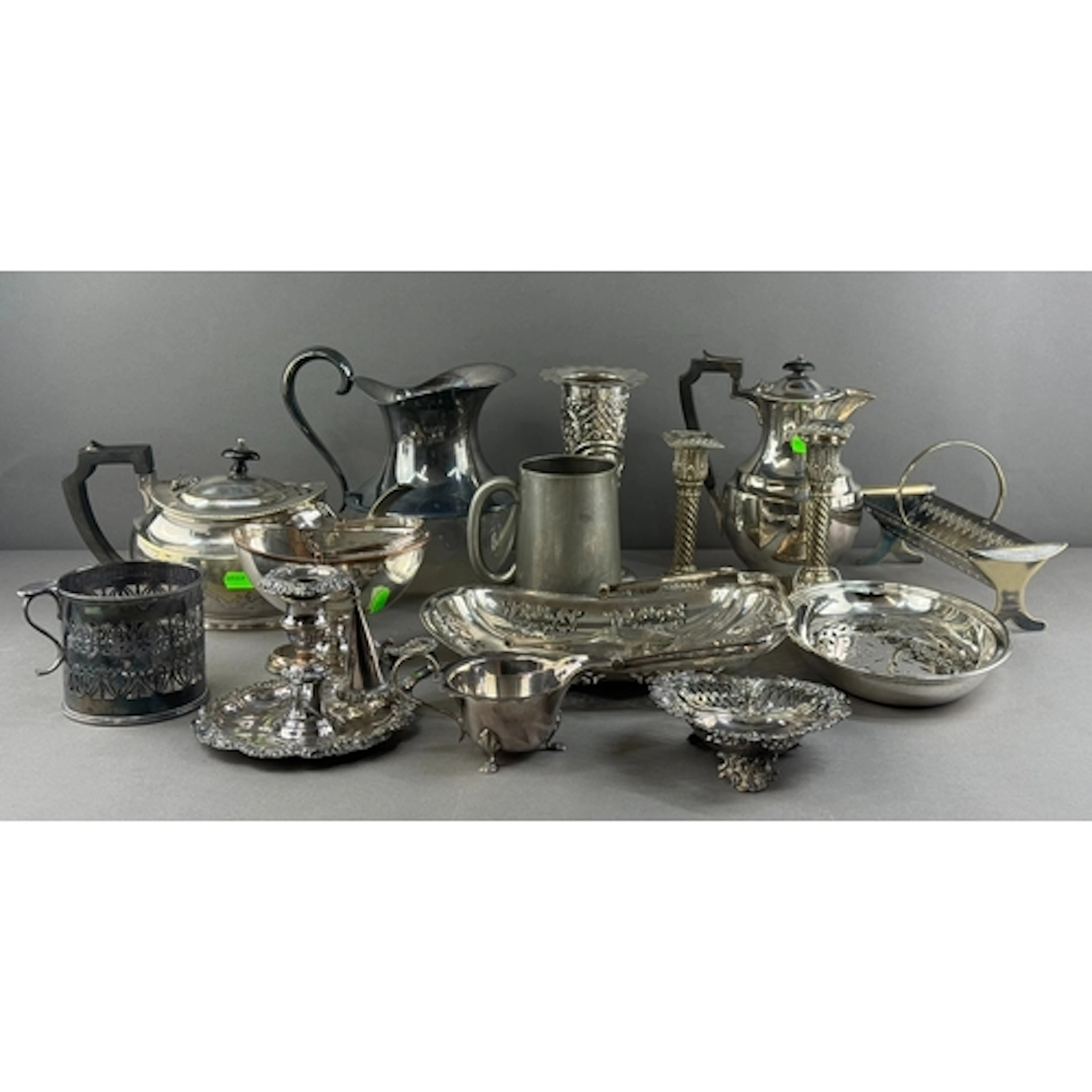 Silver Plate: a pair of spiral candlesticks with square base...