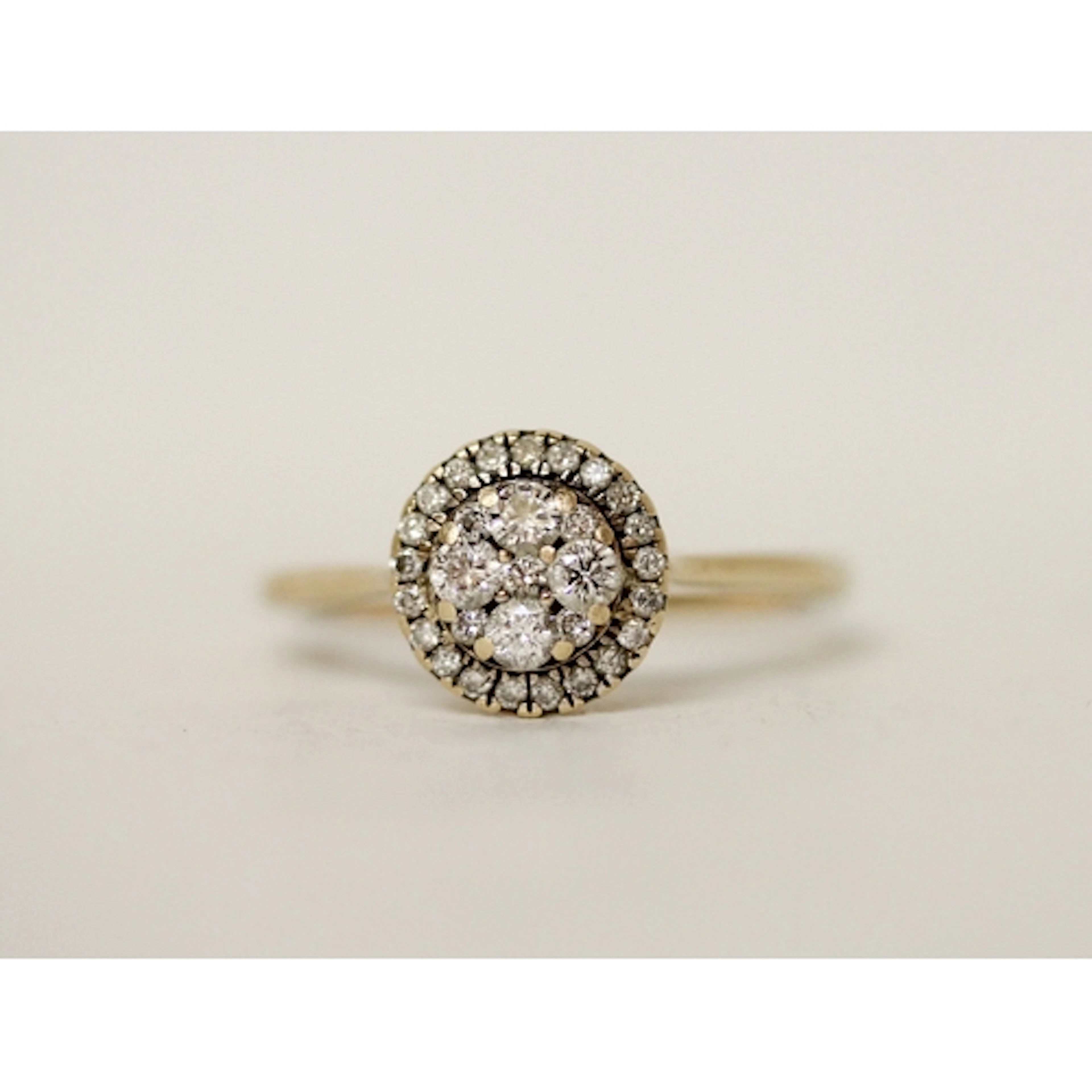 A pretty diamond halo cluster ring, ring size S, on unmarked...