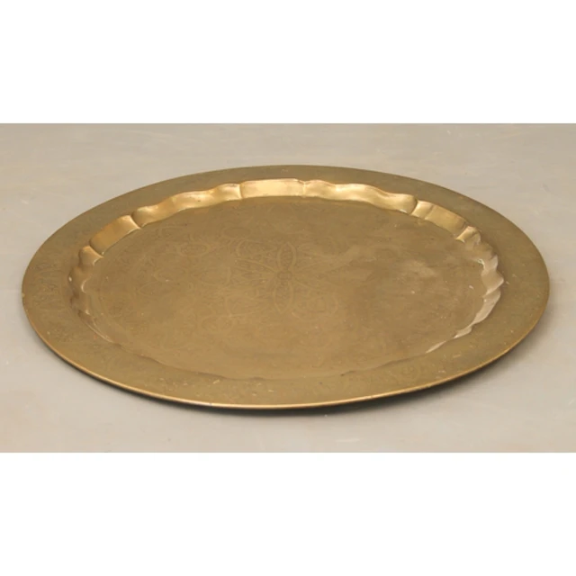 A large antique Eastern circular brass tray - the well and l...
