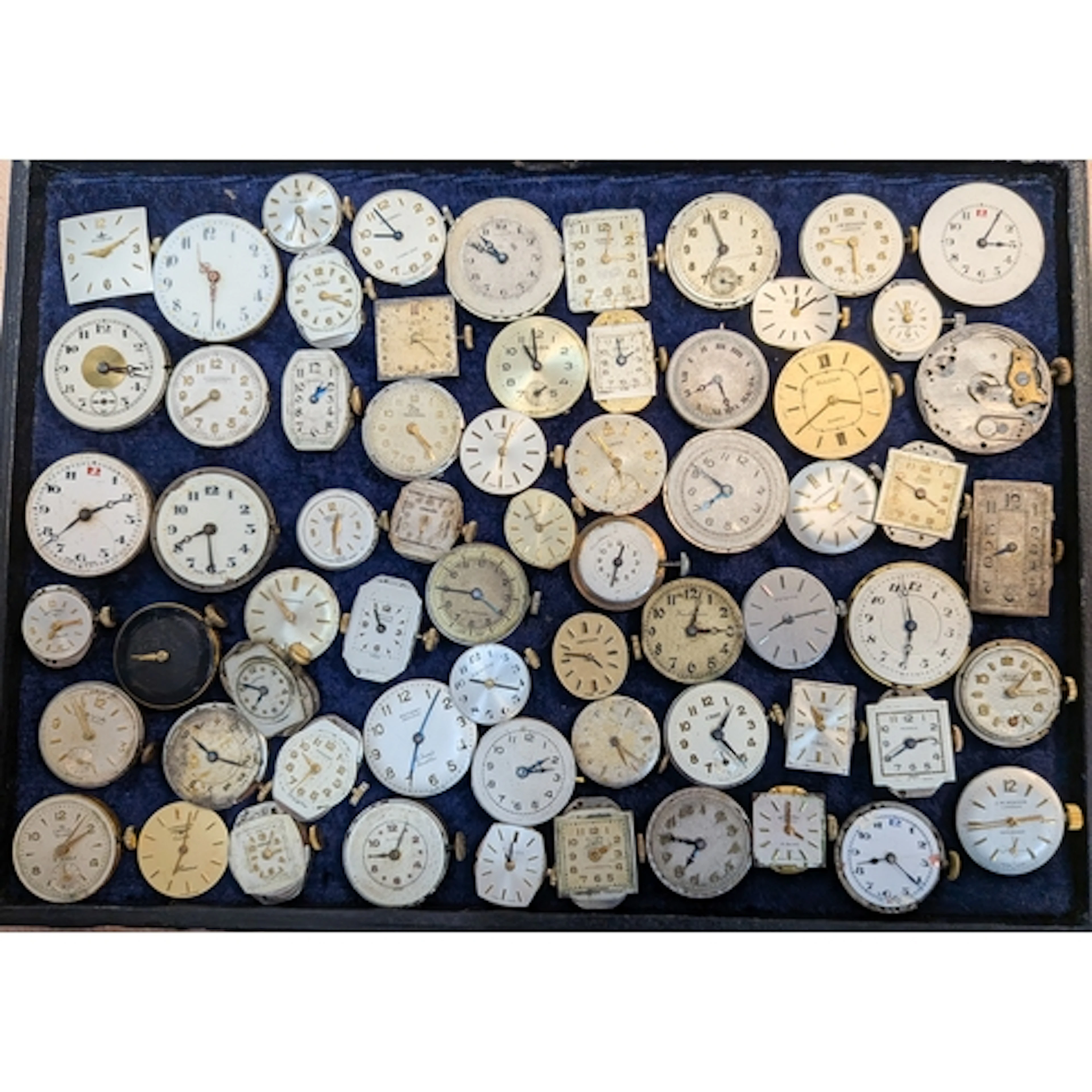 A large collection of ladies wristwatch movements and faces ...