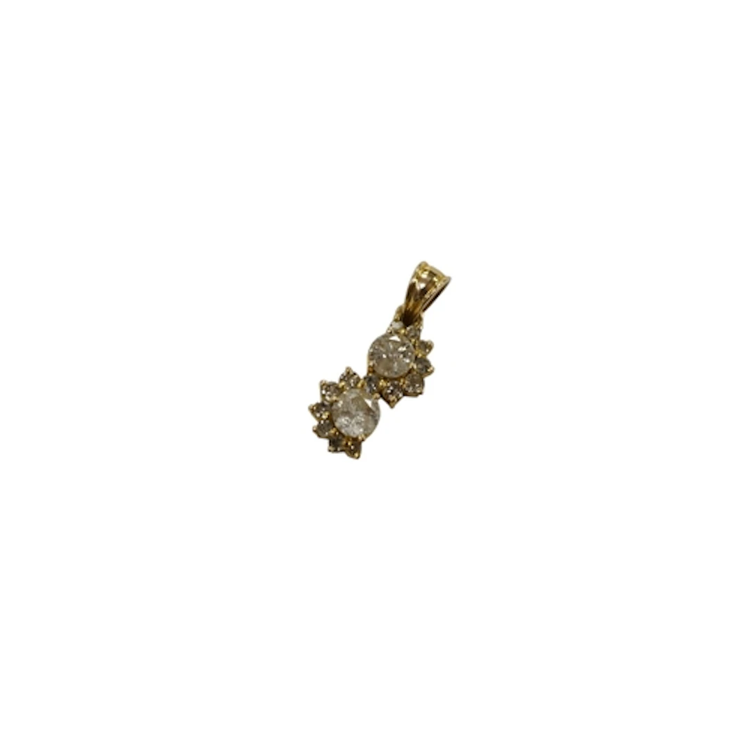 An unmarked yellow metal and two stone diamond pendant, with...