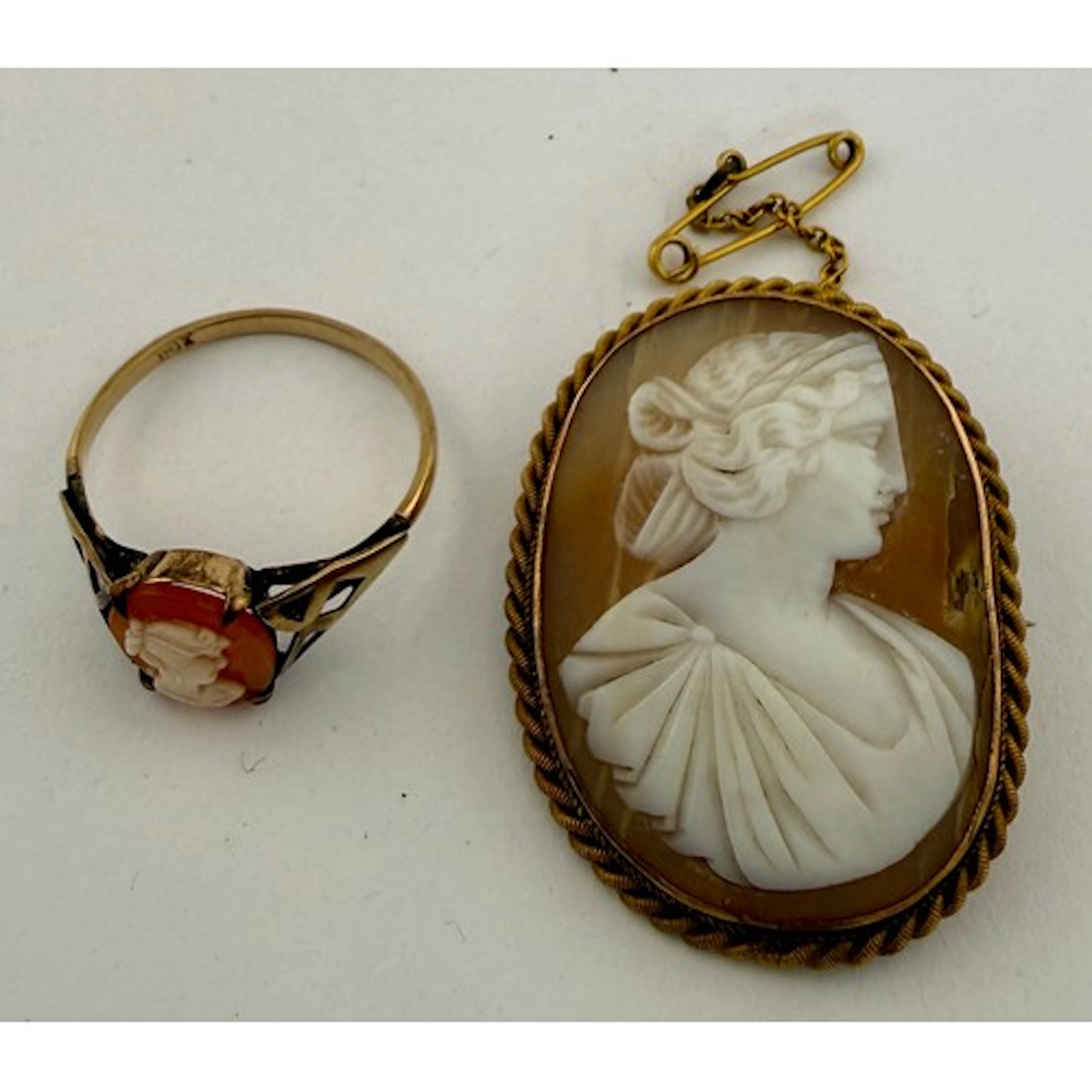 A 9 carat gold framed shell cameo brooch together with a 9 c...