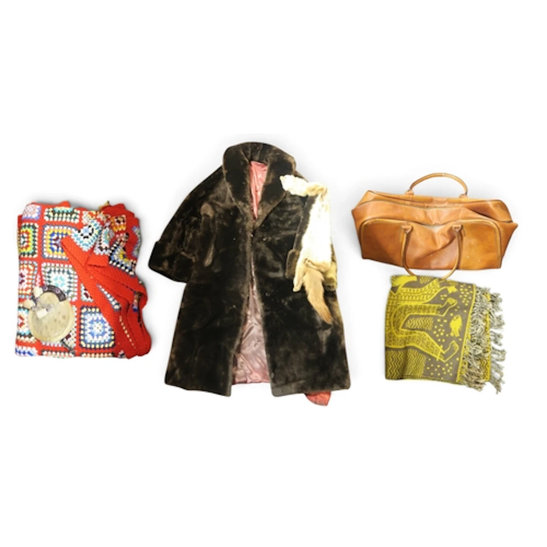A dark brown Tescan lamb coat, a sealskin sporran, a large c...