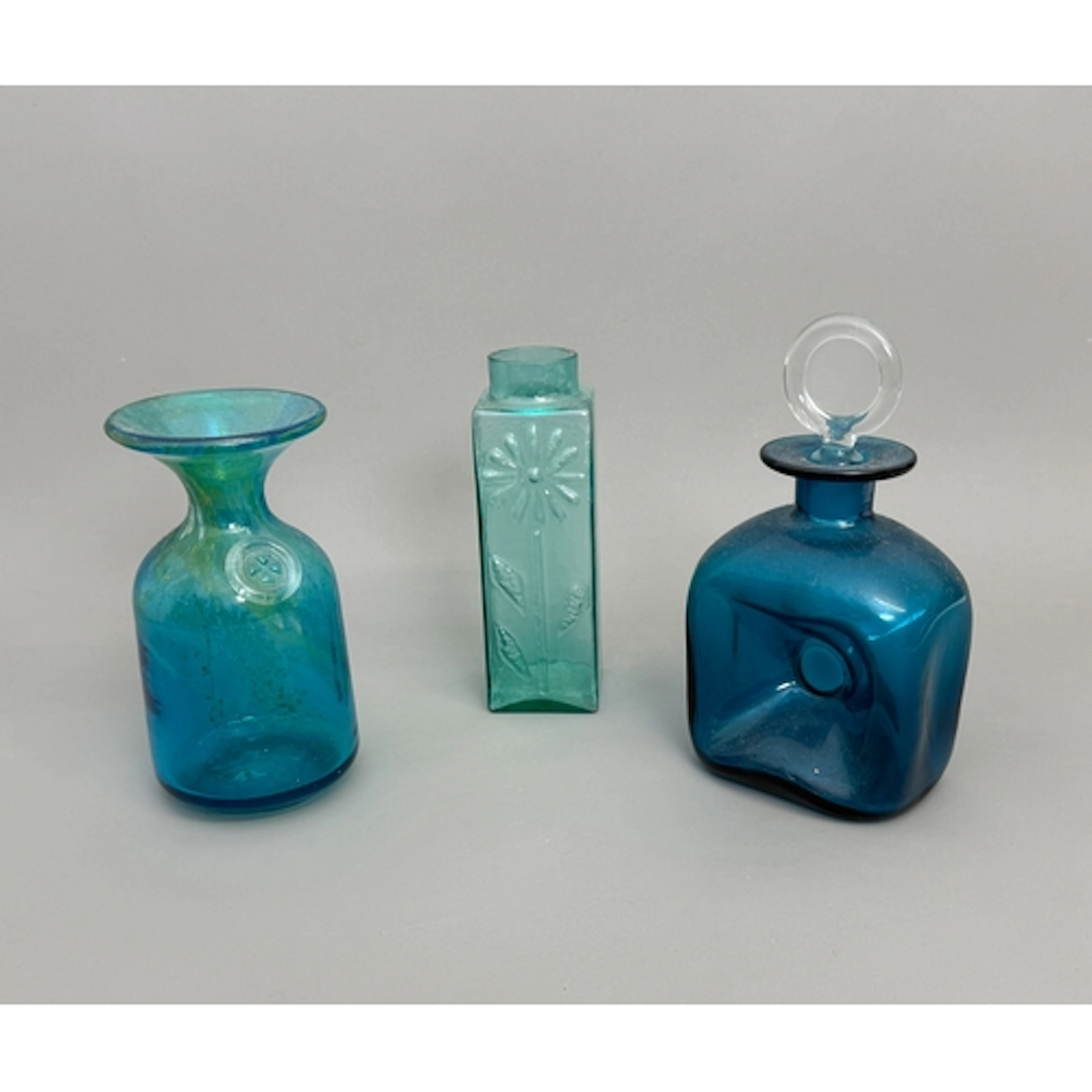 A turquoise Mdina carafe - with flared rim and Maltese cross...