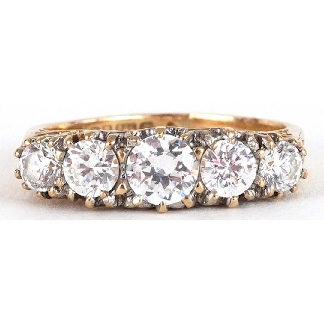 9ct gold graduated clear stone ring, size J, 2.5g.