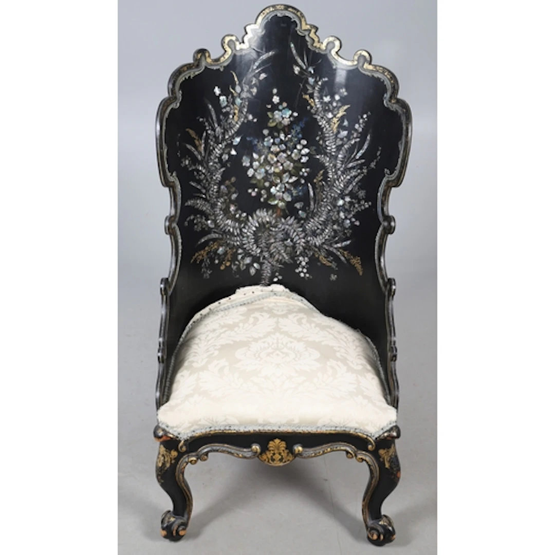 A VICTORIAN LACQUERED AND INLAID SALON CHAIR. the shaped cur...