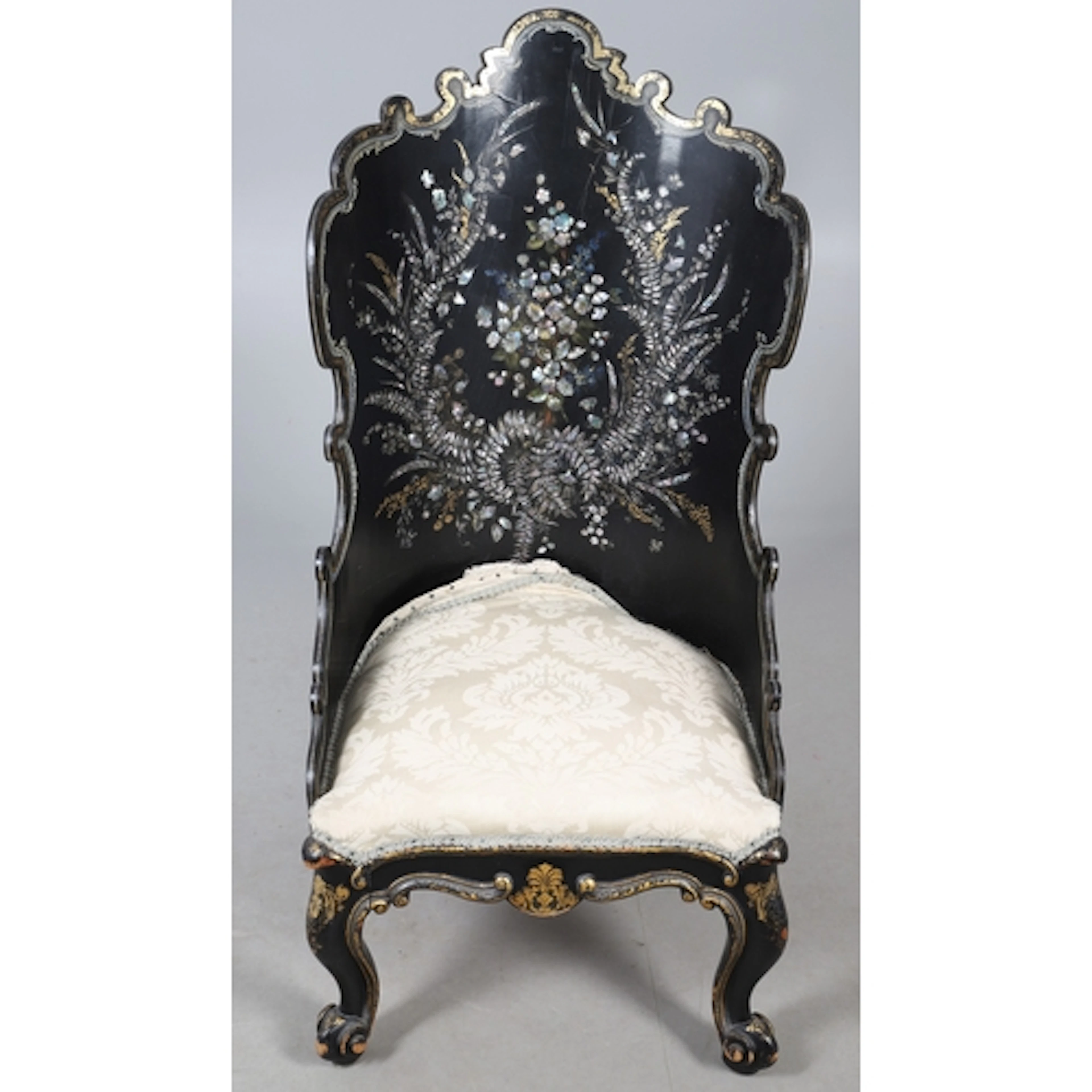 A VICTORIAN LACQUERED AND INLAID SALON CHAIR. the shaped cur...