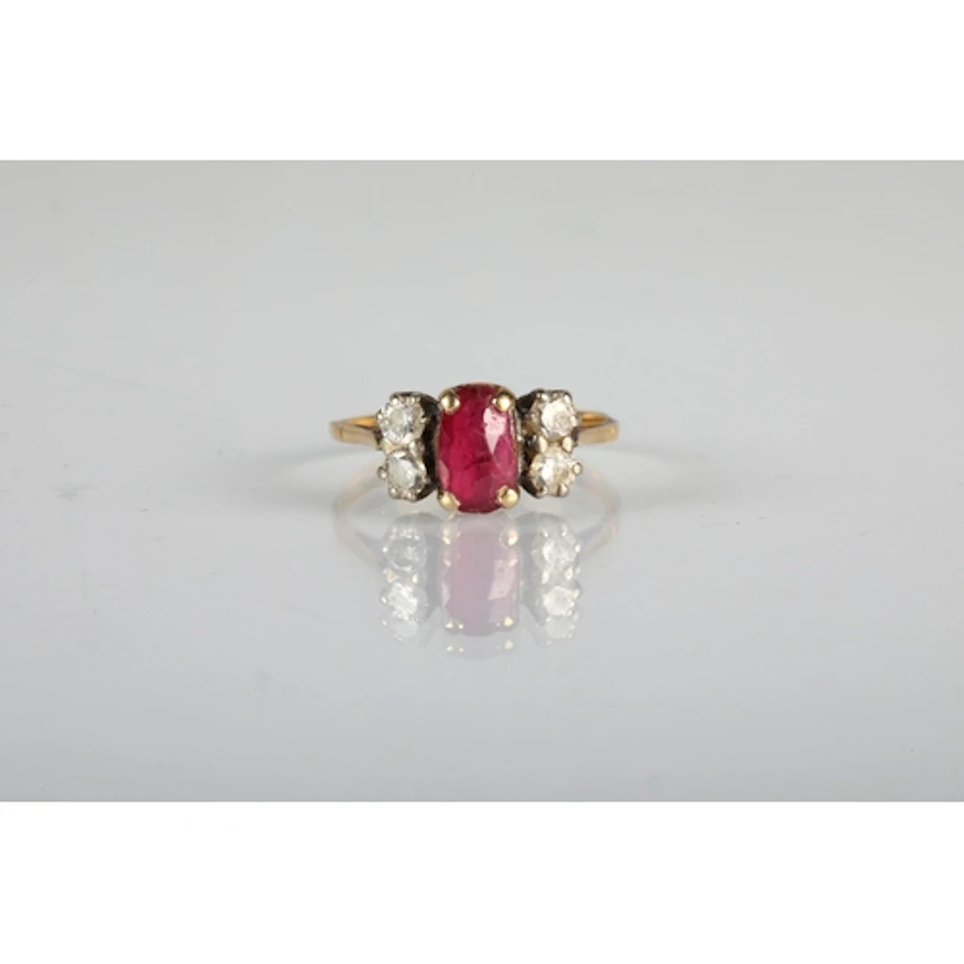 Ladies ruby and diamond ring central ruby with two small dia...