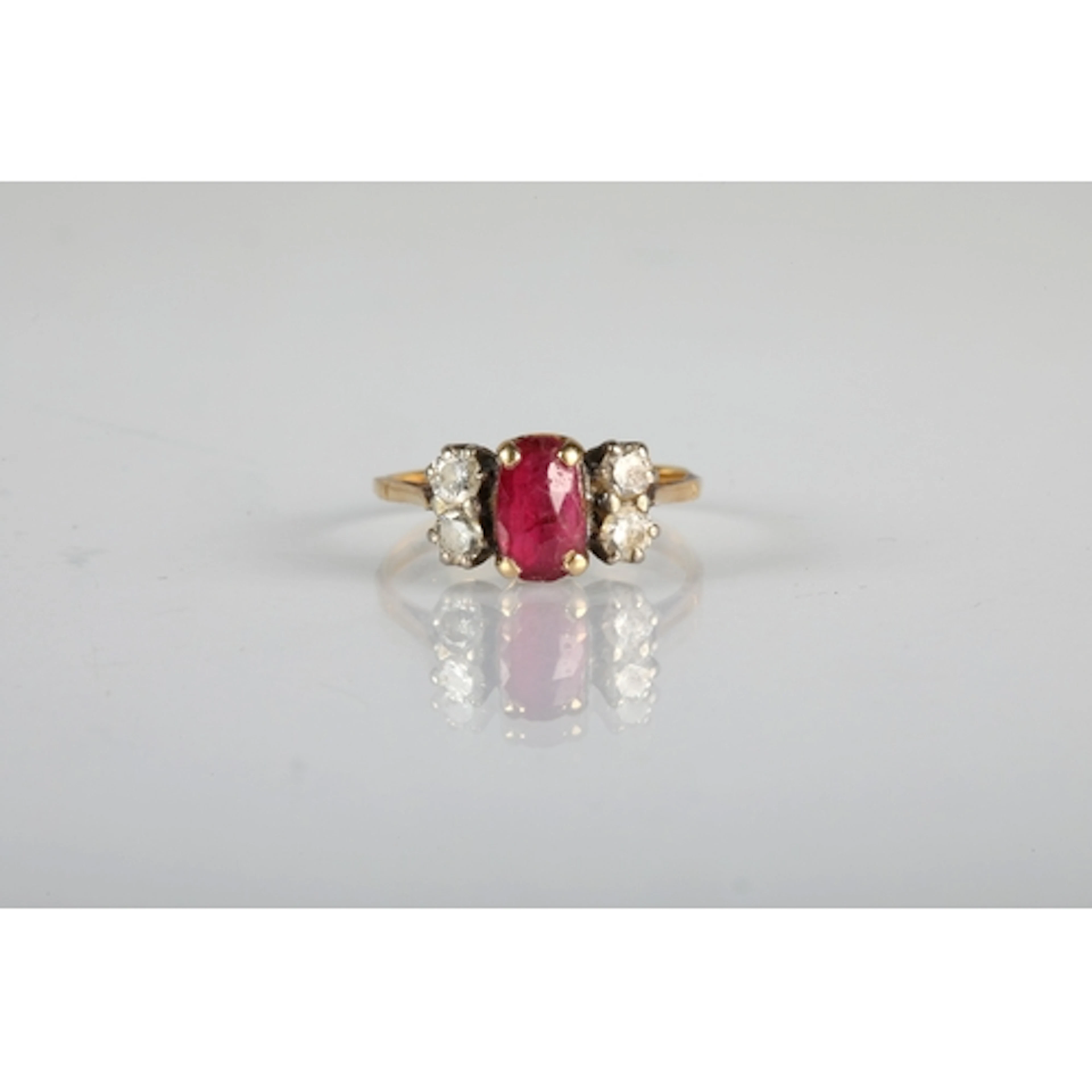 Ladies ruby and diamond ring central ruby with two small dia...