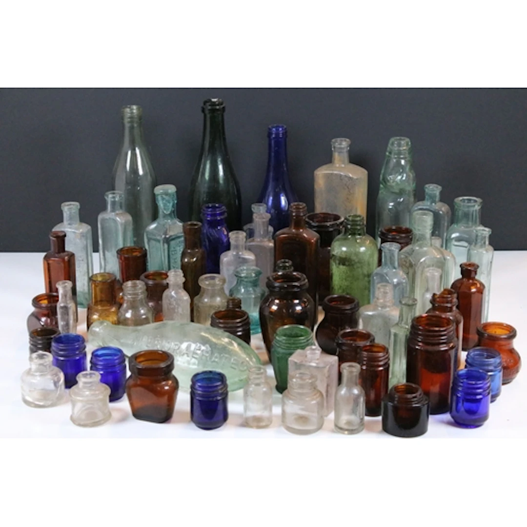 Collection of antique and later glass bottles, comprising va...