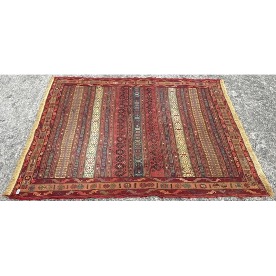 A hand-woven wool on wool tribal Rah Rah rug, 200cm L x 159c...