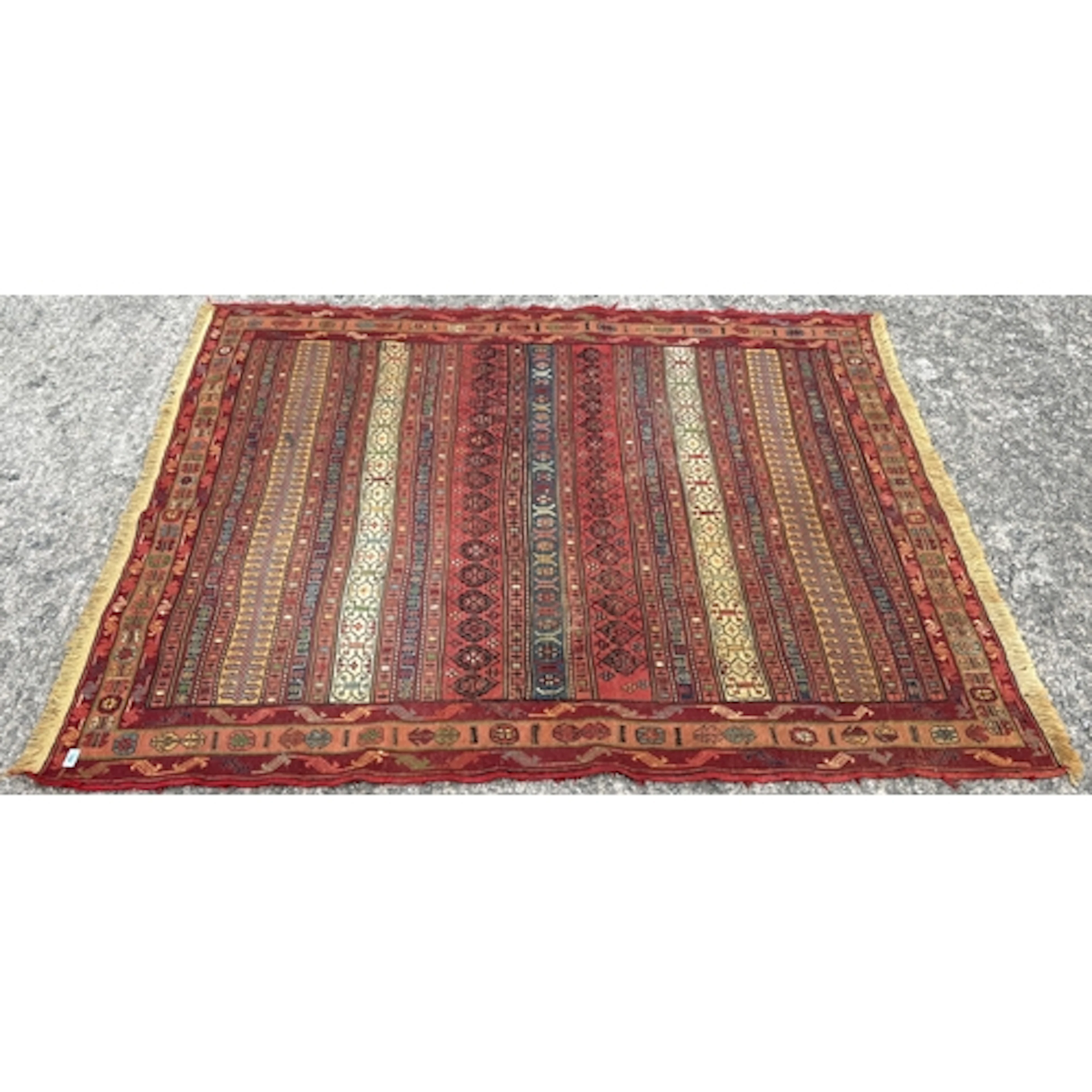 A hand-woven wool on wool tribal Rah Rah rug, 200cm L x 159c...