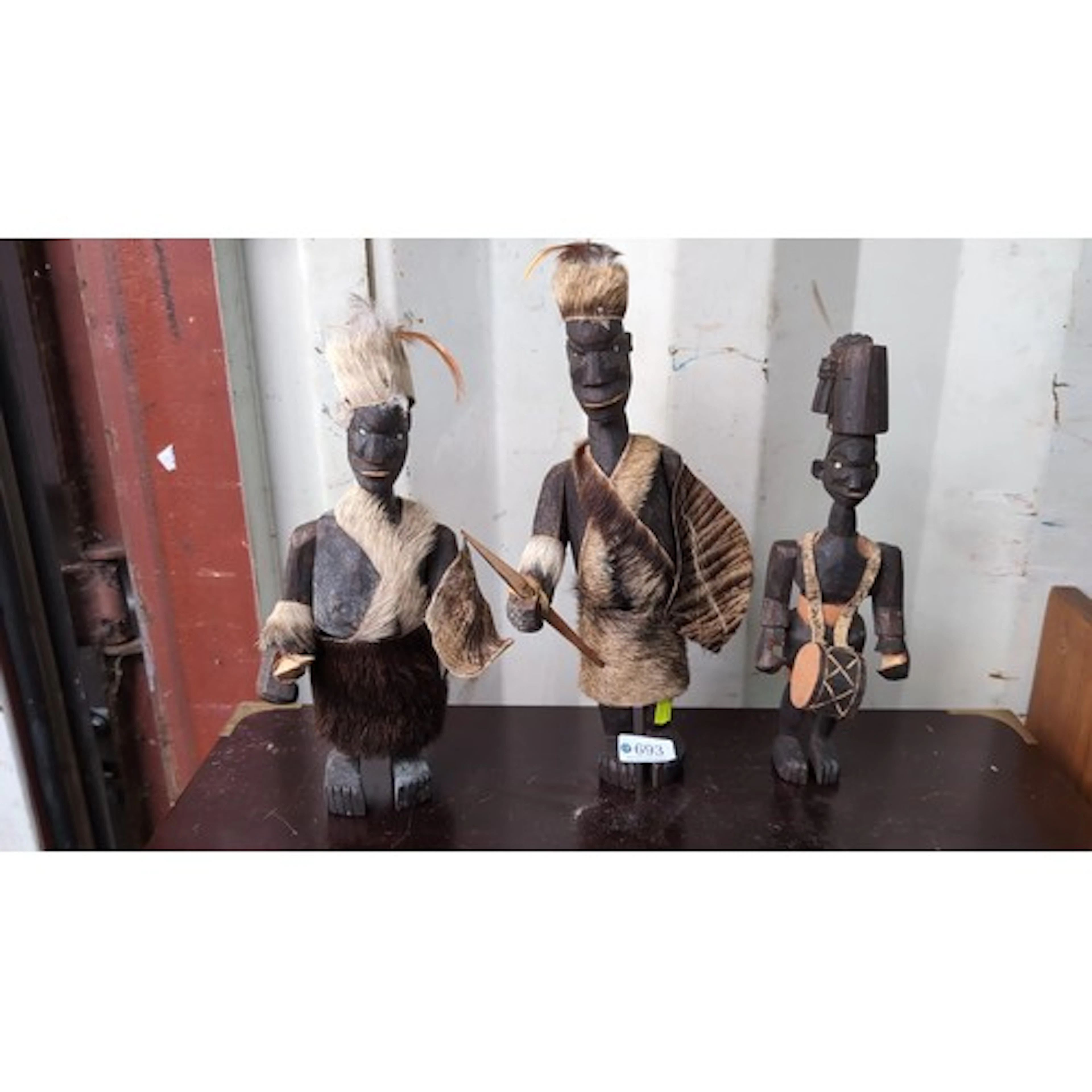 A group of three carved wooden figural sculptures, probably ...