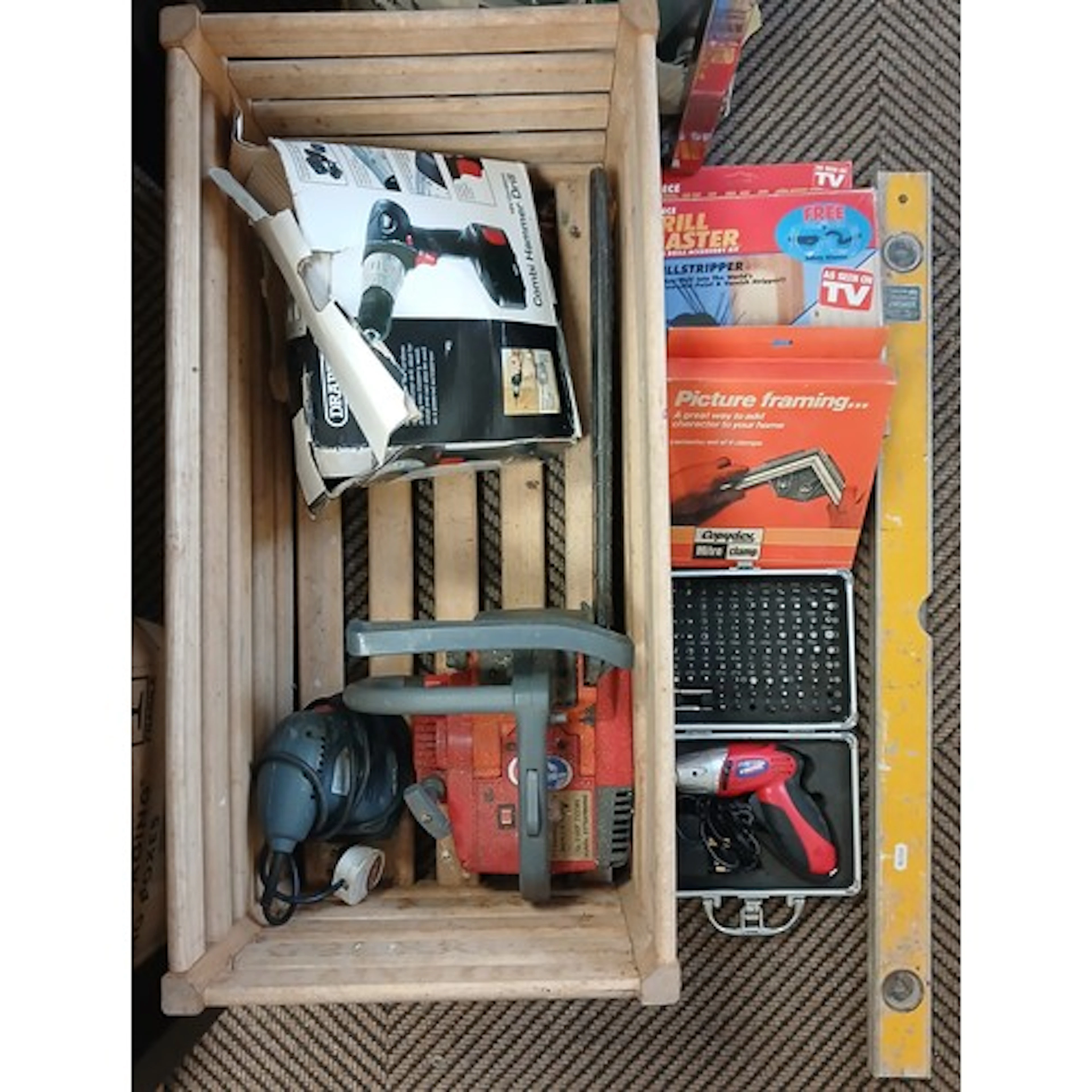 Hammer drill, leveller, power drill accessory kit, a chain s...