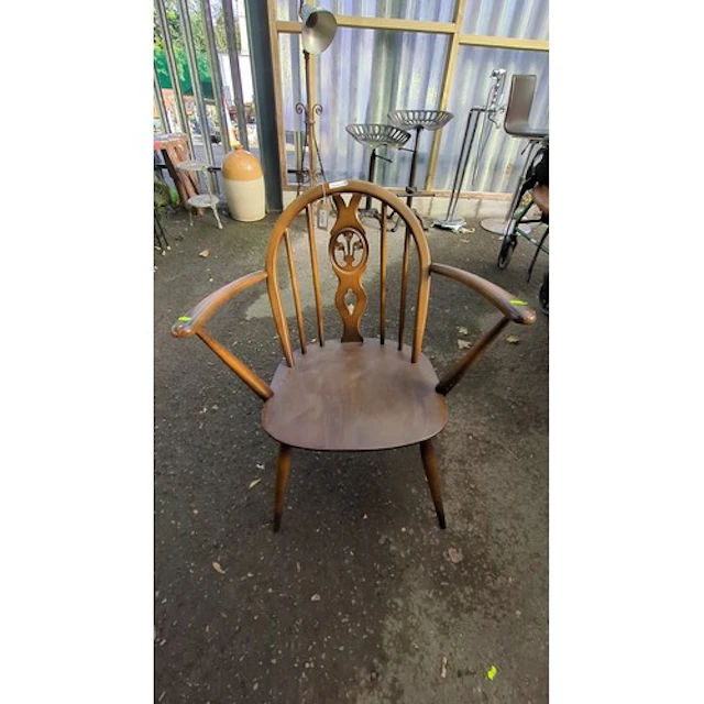Ercol Windsor armchair of elm and beech, with a hoop back ce...