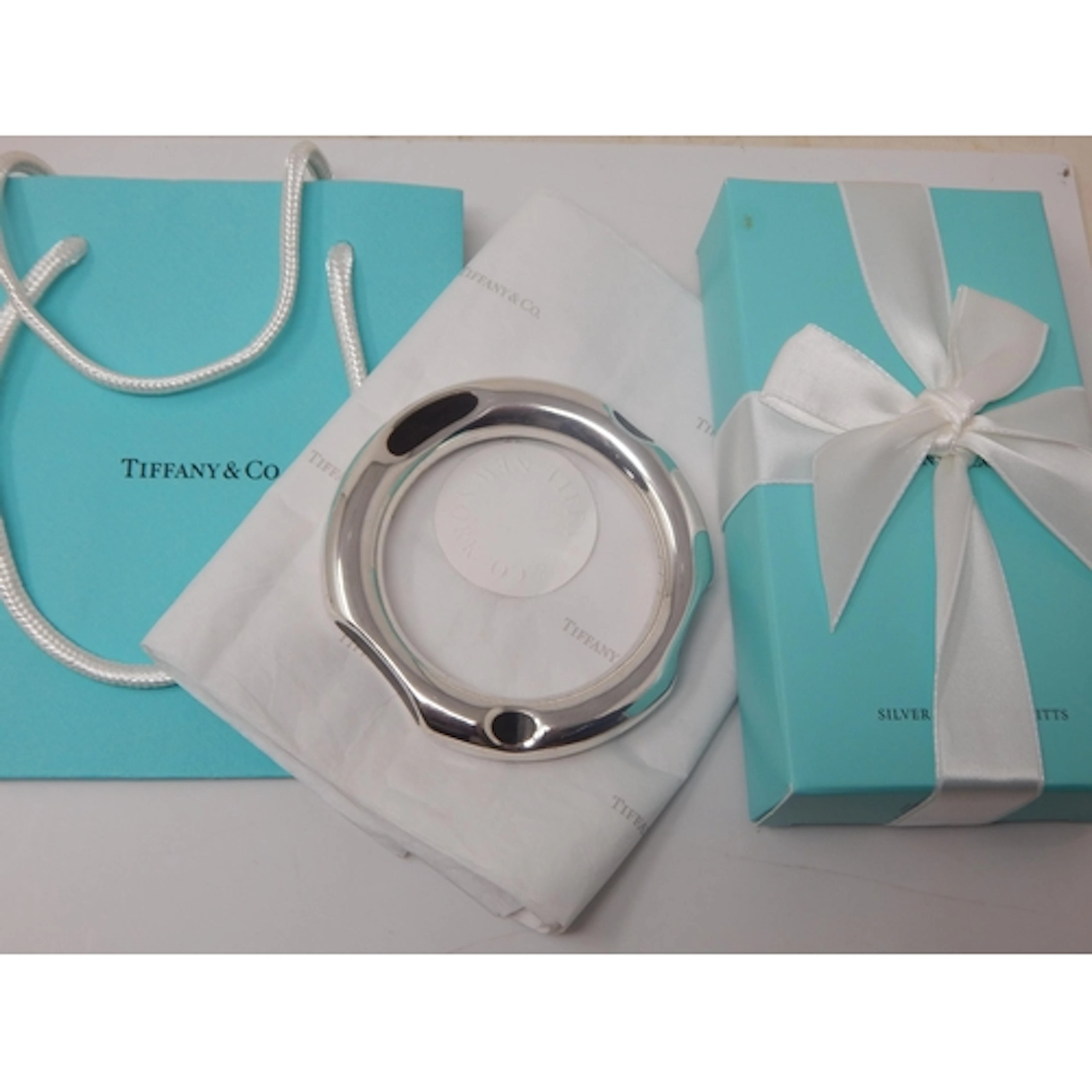 A Tiffany & Co, Frank Gehry Sterling Silver & Ebony Bangle, ...