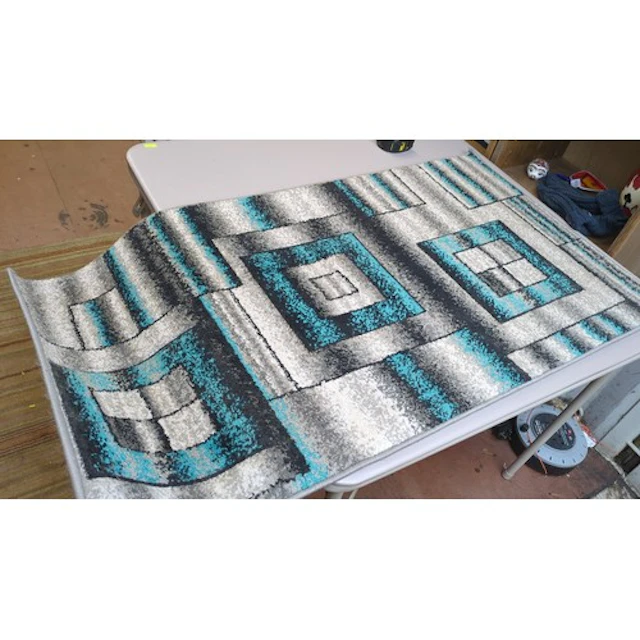 A group of four contemporary machine-woven rugs with abstrac...