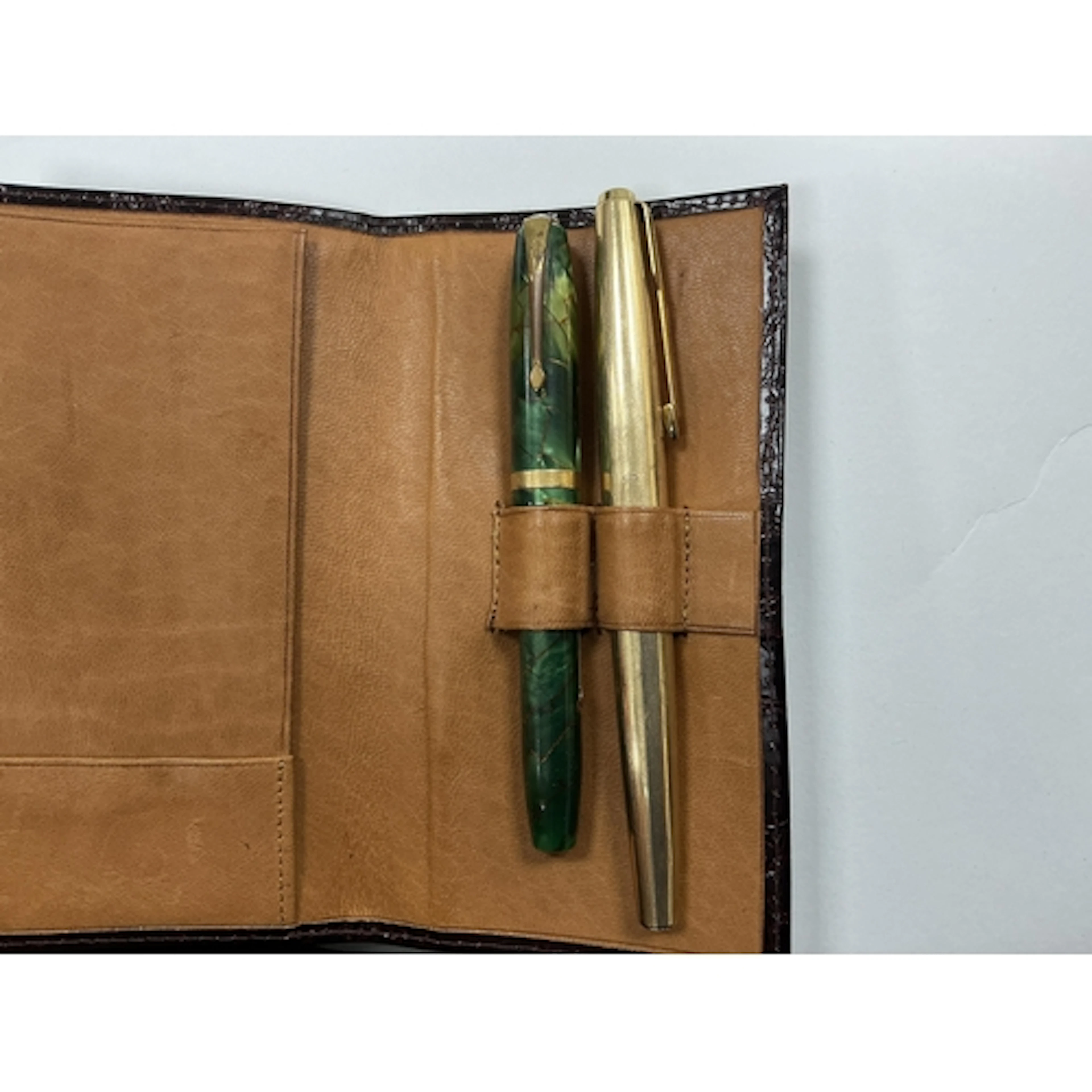A Parker rolled gold fountain pen and a Conway Stewart fount...
