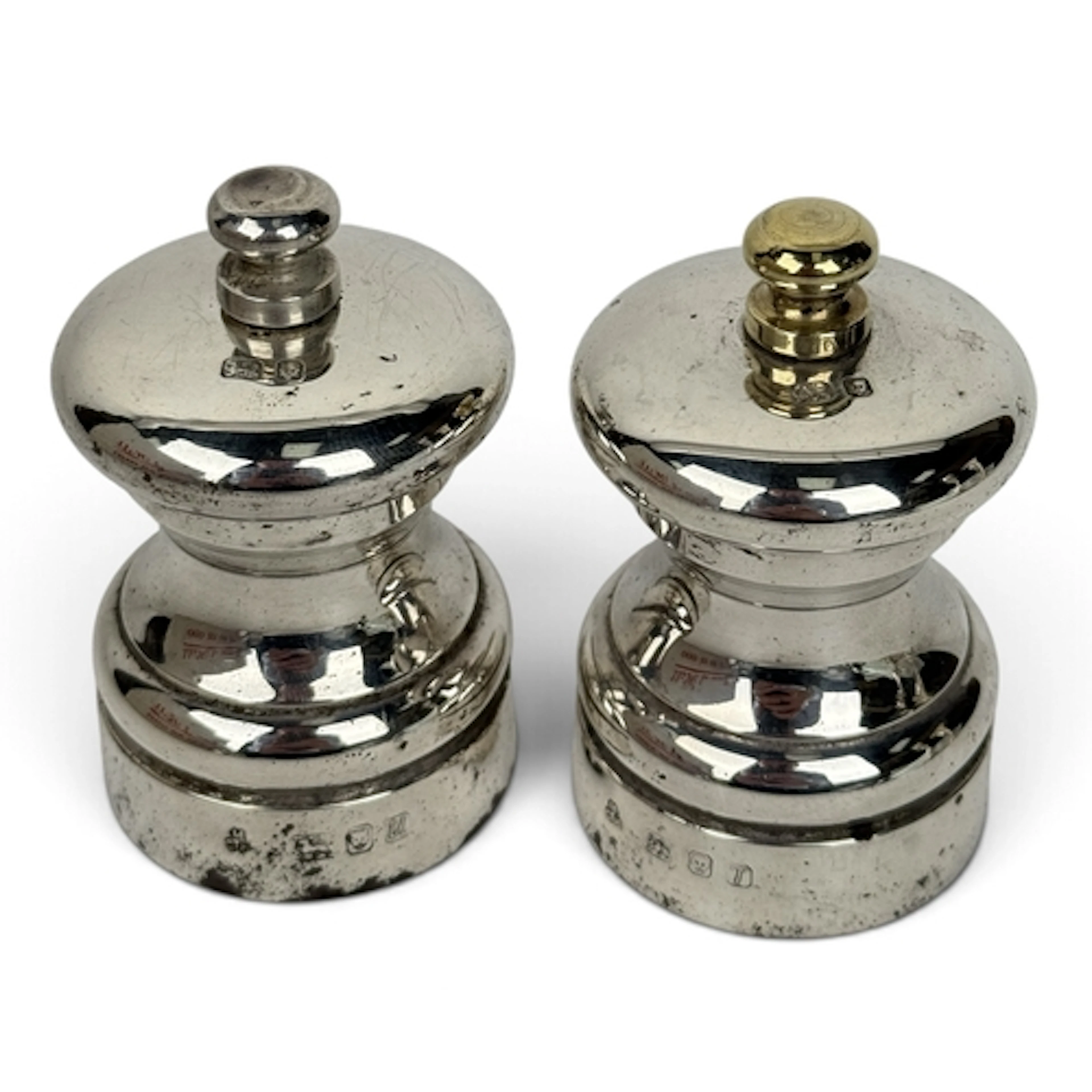 A PAIR OF ELIZABETH II SILVER PETER PIPER SALT AND PEPPER MI...